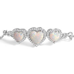Pulsera tipo bolo de plata de ley .925 con ópalo sintético, tres corazones y zafiro blanco