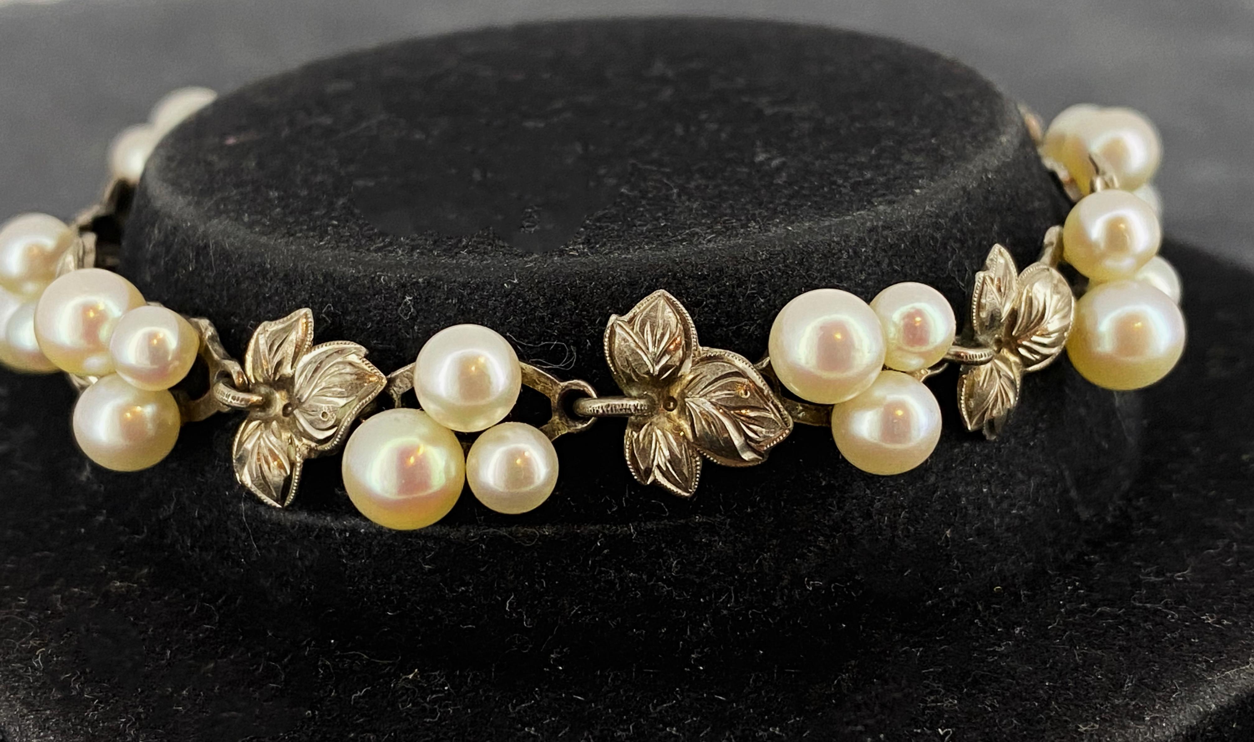 Meticulously crafted in 925 Sterling Silver,  
this delightful vintage bracelet features 
30 cultured pearls of gorgeous crème colour & high luster

It’s designed in lovely foliate motif
with clusters of 3 pearls of various sizes,
alternating with