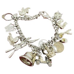 925 Sterling Silver Curb Link Vintage Charm Bracelet with 20 Charms. 59.6gr.