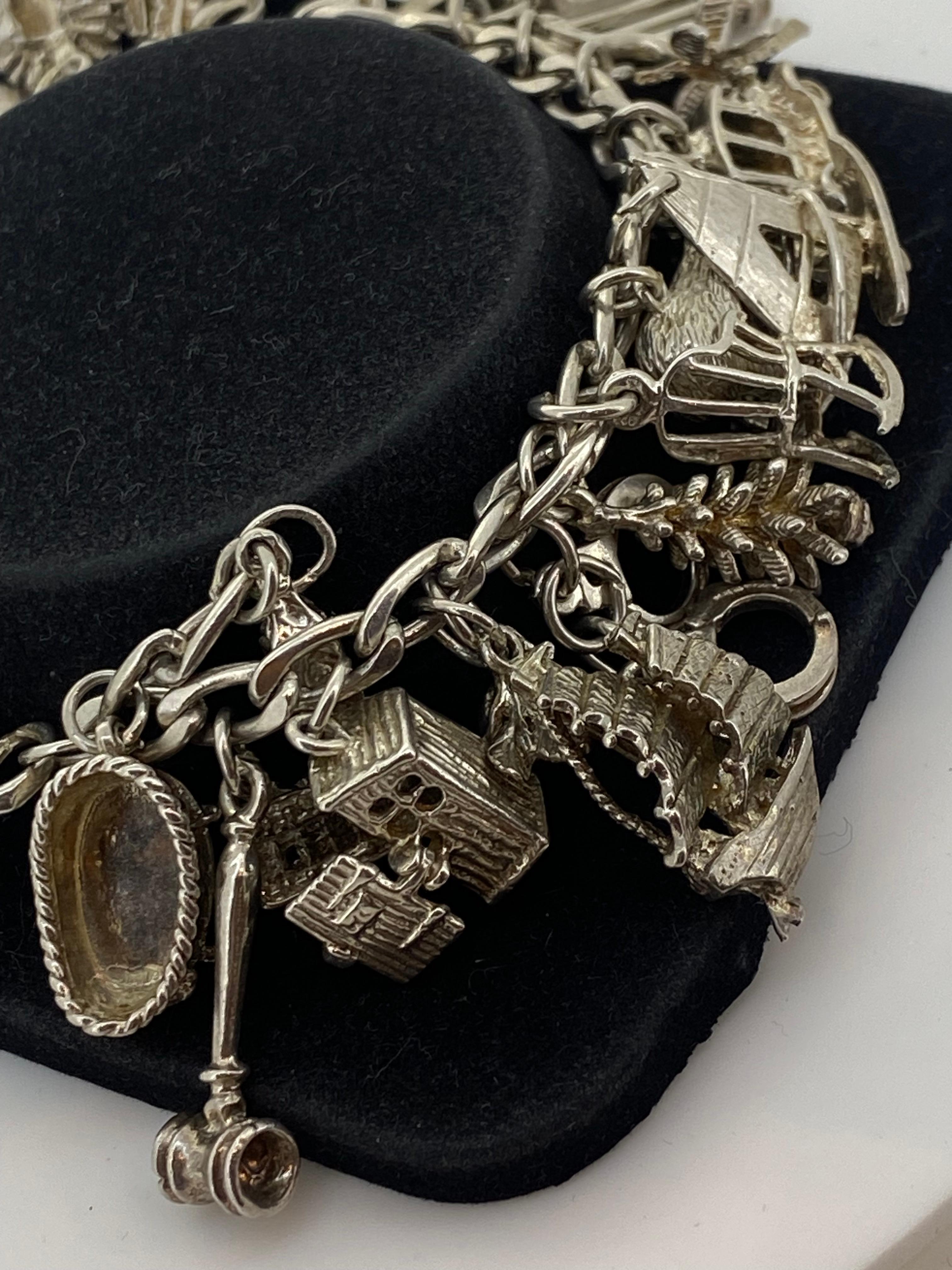 925 Sterling Silver Curb Link Vintage Charm Bracelet with 24 Charms. 59.3gr. In Excellent Condition In MELBOURNE, AU