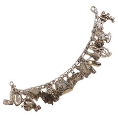 925 Sterling Silver Curb Link Vintage Charm Bracelet with 24 Charms. 59.3gr.