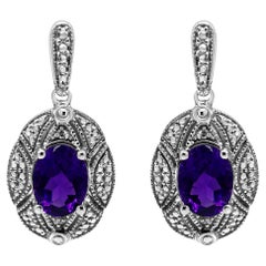 Boucles d'oreilles en argent 925 serties de diamants et d'améthystes ovales violettes