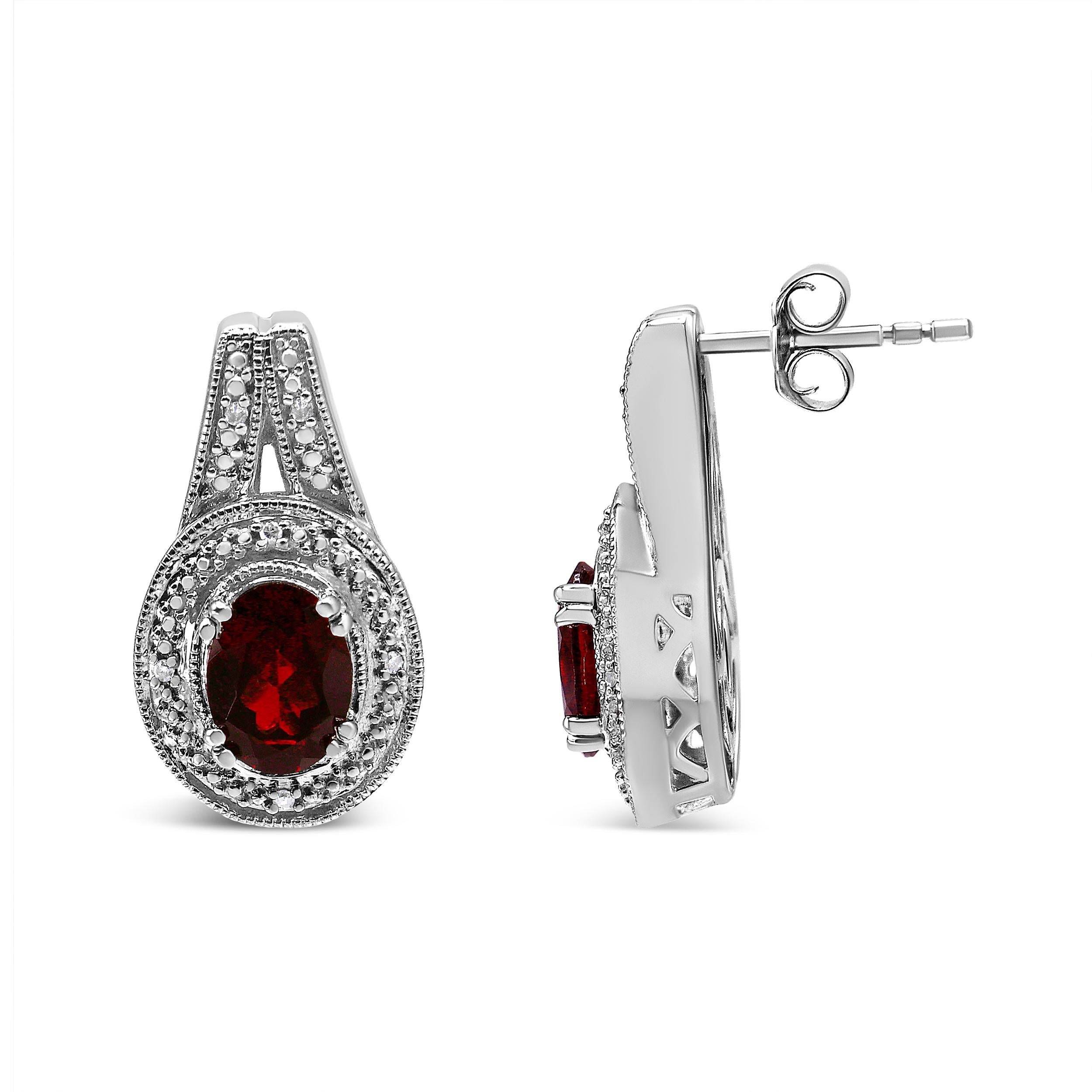 Contemporary .925 Sterling Silver Diamond Accent and 8x6mm Red Oval Garnet Stud Earrings For Sale