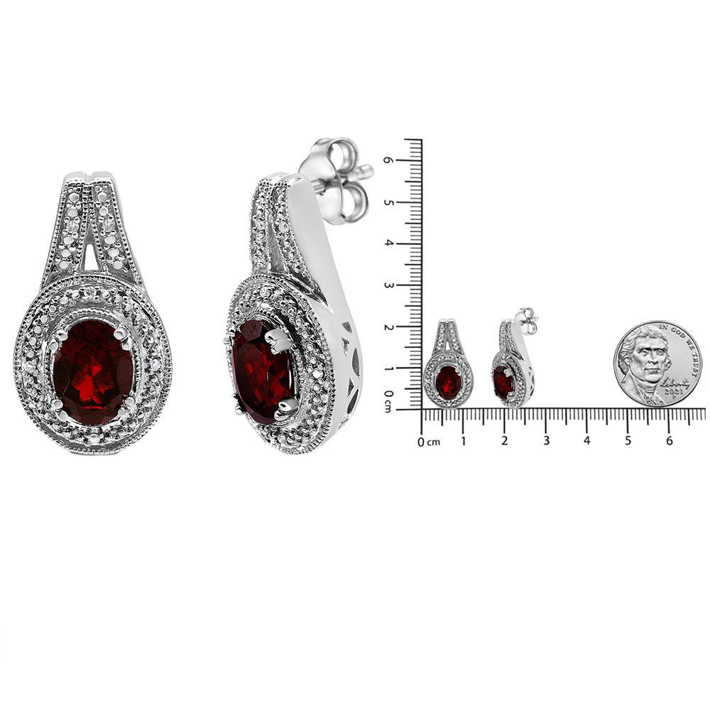 .925 Sterling Silver Diamond Accent and 8x6mm Red Oval Garnet Stud Earrings In New Condition For Sale In New York, NY