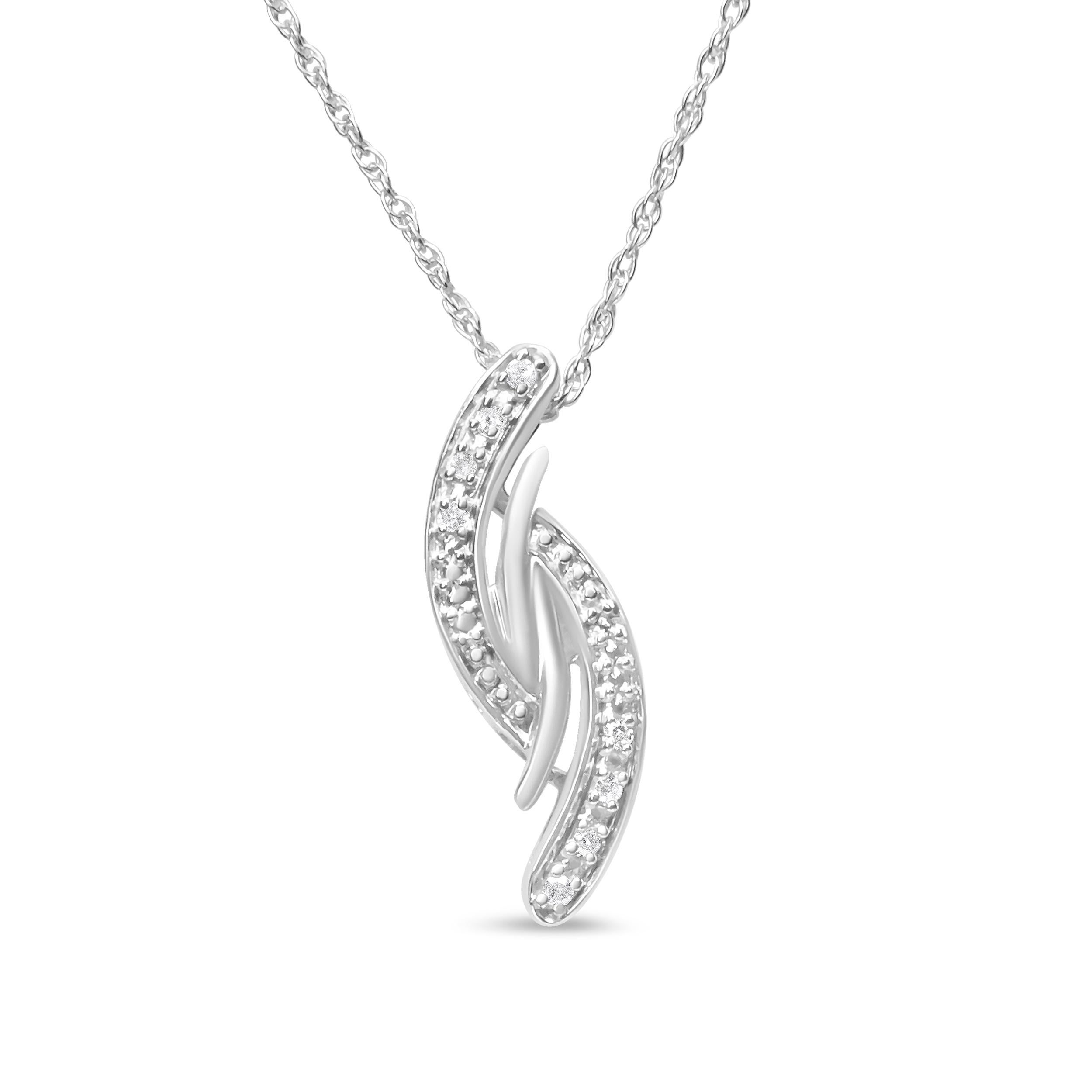 Simple in design and classy by look, this diamond pendant is composed of alluring sterling silver. The intriguing neckpiece is embellished with shimmering round cut diamonds. Polished high to shine with grace, the pendant will look even more
