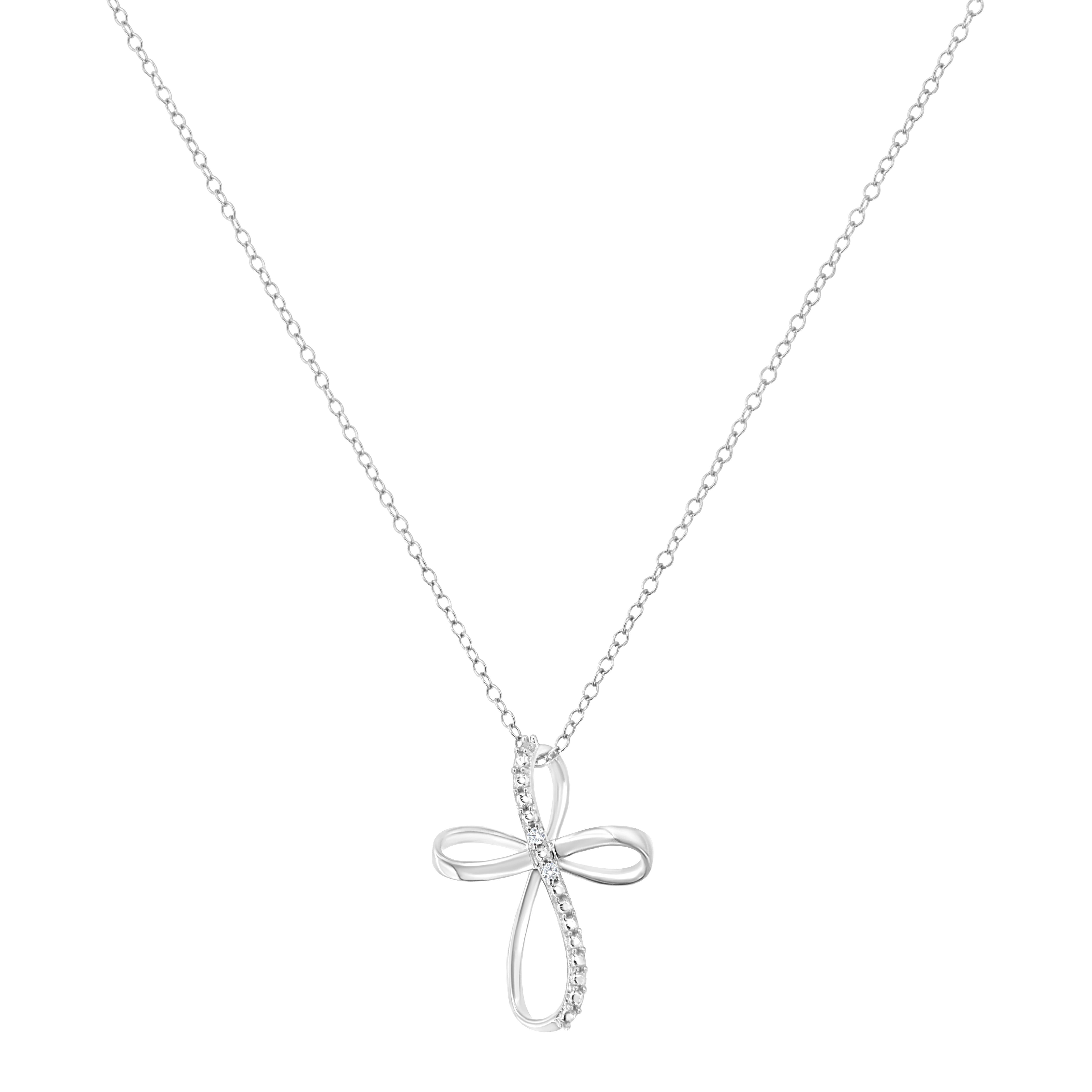 Show off your faith with this .925 sterling silver ribbon cross pendant. The cross shaped pendant crafted with warm weaves of white rhodiumed sterling silver and is accented with 2 natural, round, diamonds, .The pendant comes on a fine sterling