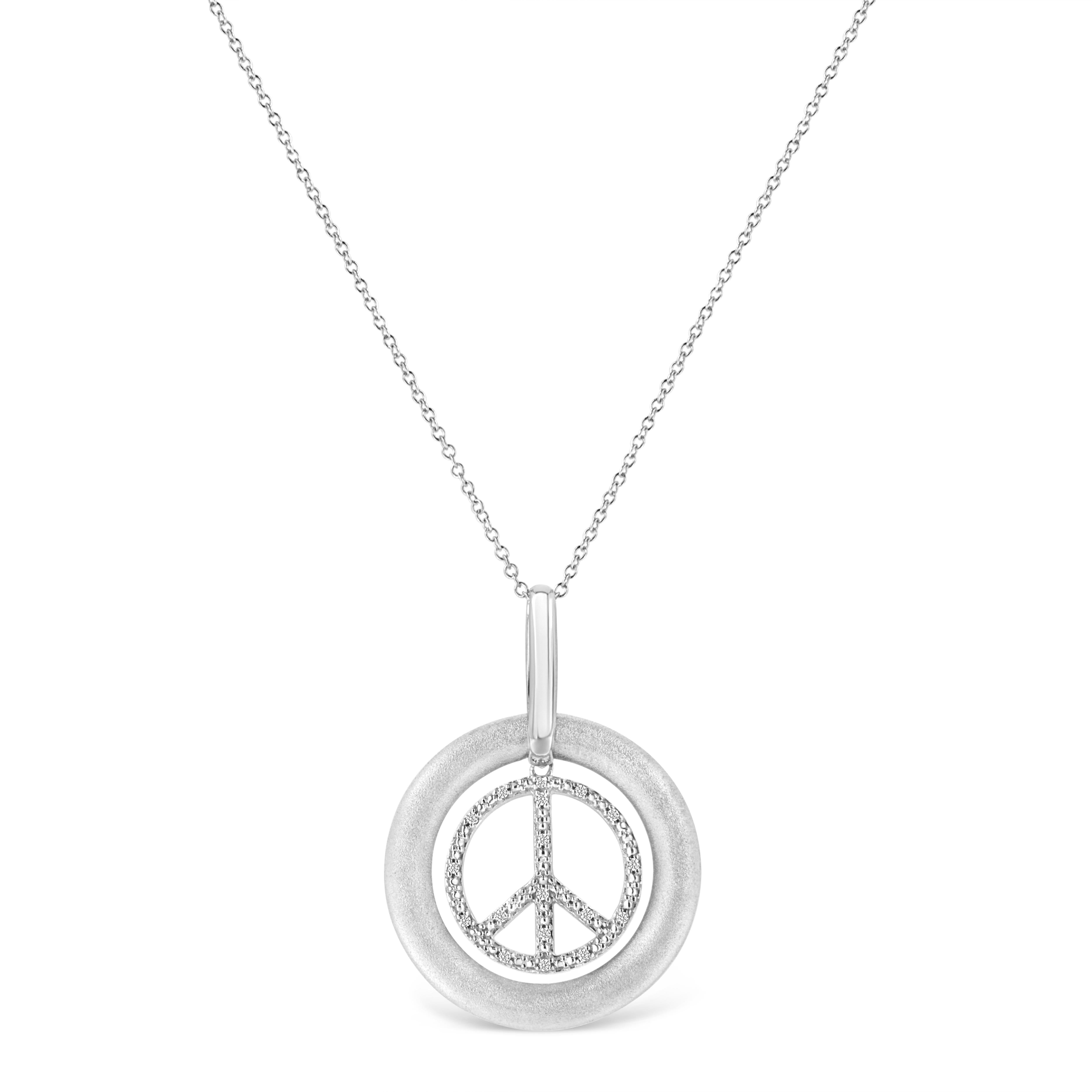 Elegant and simple, this pewter diamond peace sign pendant spreads the message of peace in the world. This icy fiery sterling silver pendant is embellished with 18 dazzling prong set single cut diamonds accents inside a large sterling silver circle.