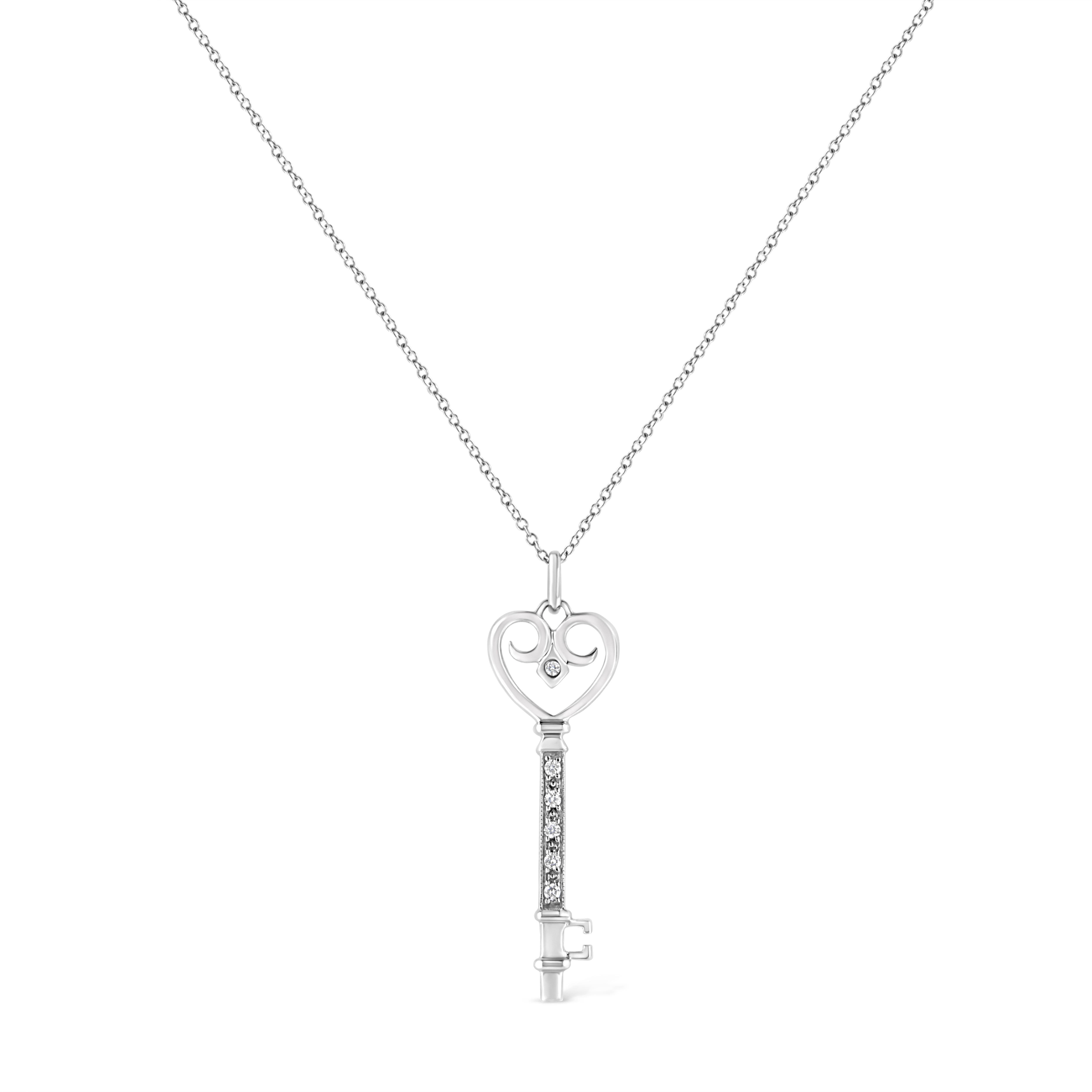 This sweet and romantic style diamond key pendant will brighten her smile. Crafted on sterling silver the heart-shaped bow of the key sparkles with a bezel set round cut diamond, while the stem and blade features 5 alluring prong set round cut