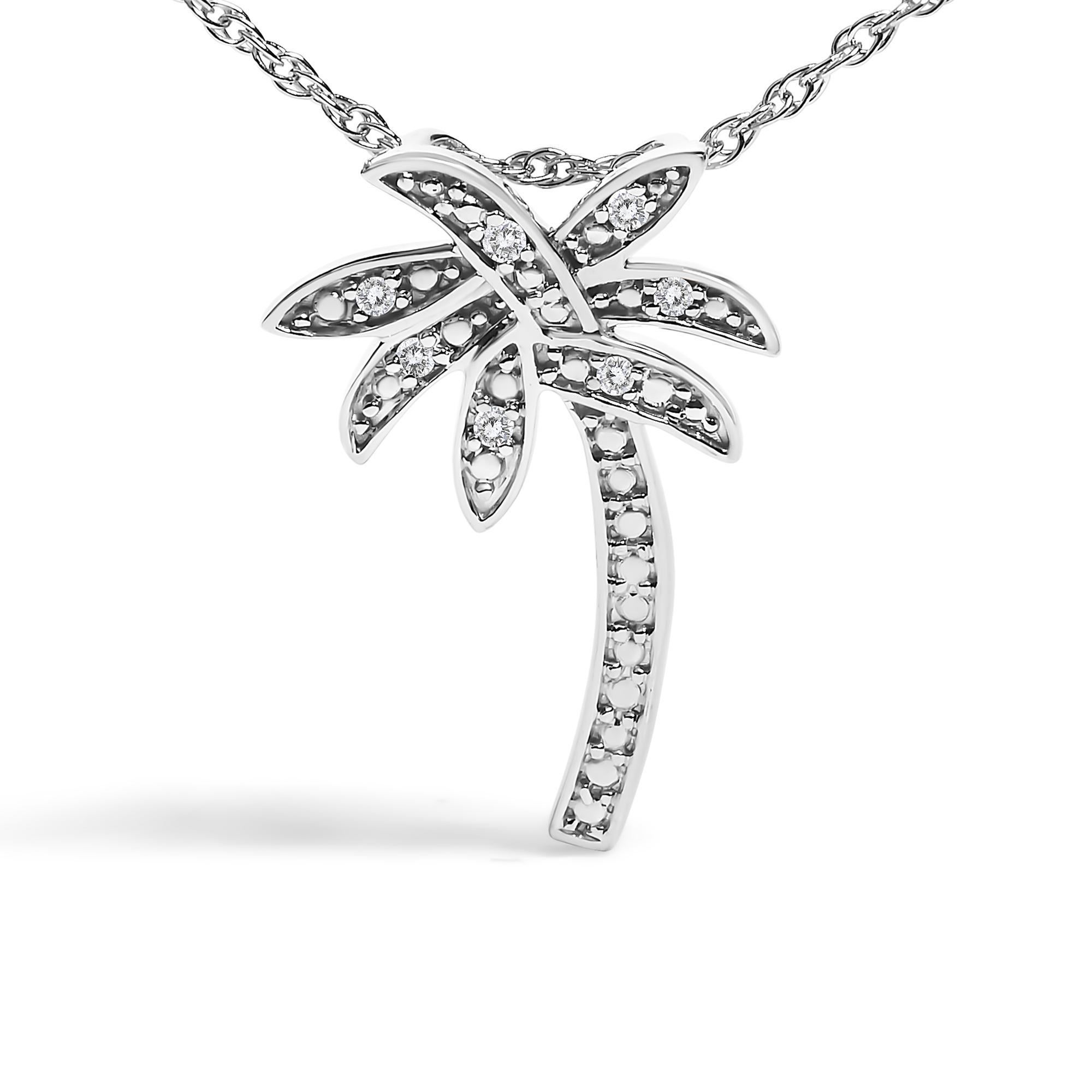 Immerse yourself in the elegance of nature with this exquisite .925 sterling silver pendant necklace, fashioned into a delicate palm tree silhouette. Adorned with seven natural diamonds that total .049 carats, each piece captures the light in a