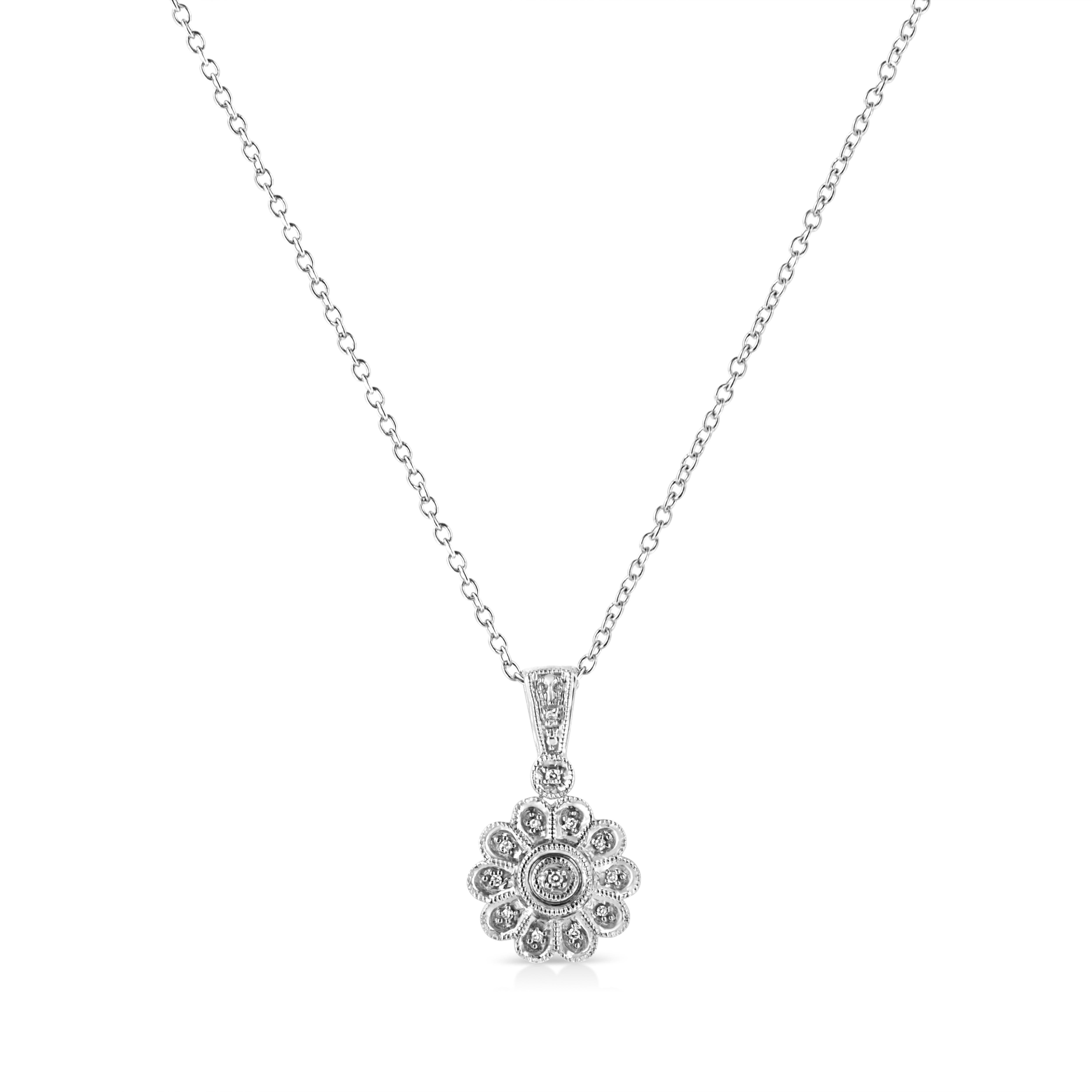 A fabulously stylish and simple milgrain finished Diamond Cluster Pendant showcases 13 single cut pave set diamonds, beautifully set to glowing perfection in floral motif. The pendant is crafted in sterling silver and suspends gracefully from a