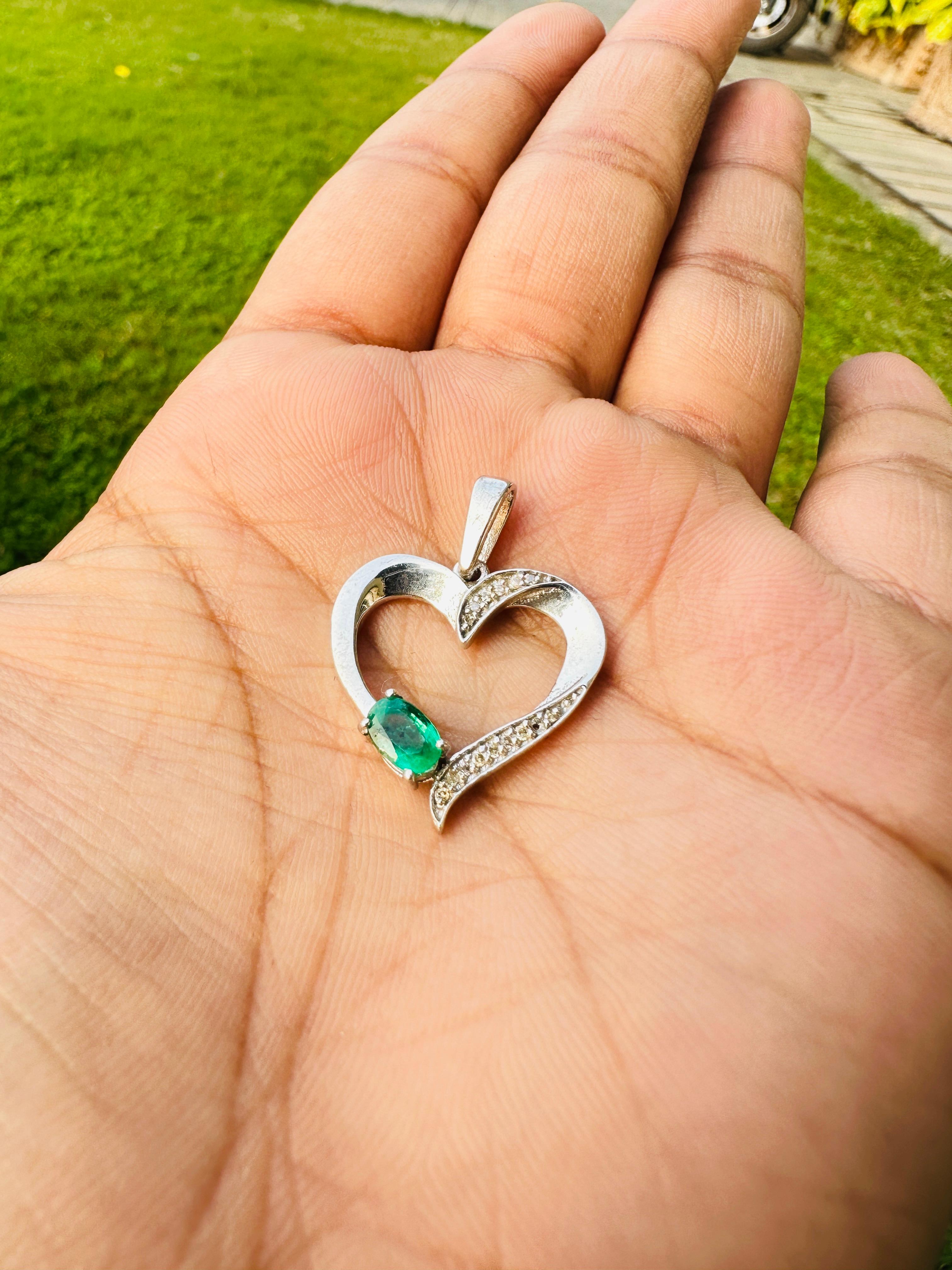 Emerald and Diamond Accent Heart Pendant in sterling silver studded with oval cut emerald and round cut diamonds. This stunning piece of jewelry instantly elevates a casual look or dressy outfit.
Emerald brings energy, calmness and happiness into