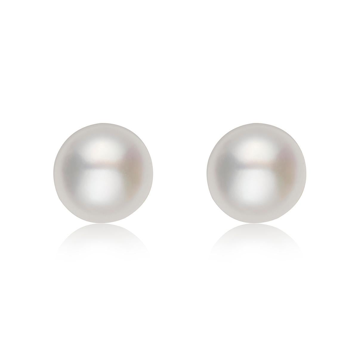 These classic studs feature Freshwater white button pearls, measuring 4-5mm. They are mounted on genuine .925 Sterling Silver. This wardrobe essential serves as the perfect compliment to every outfit.