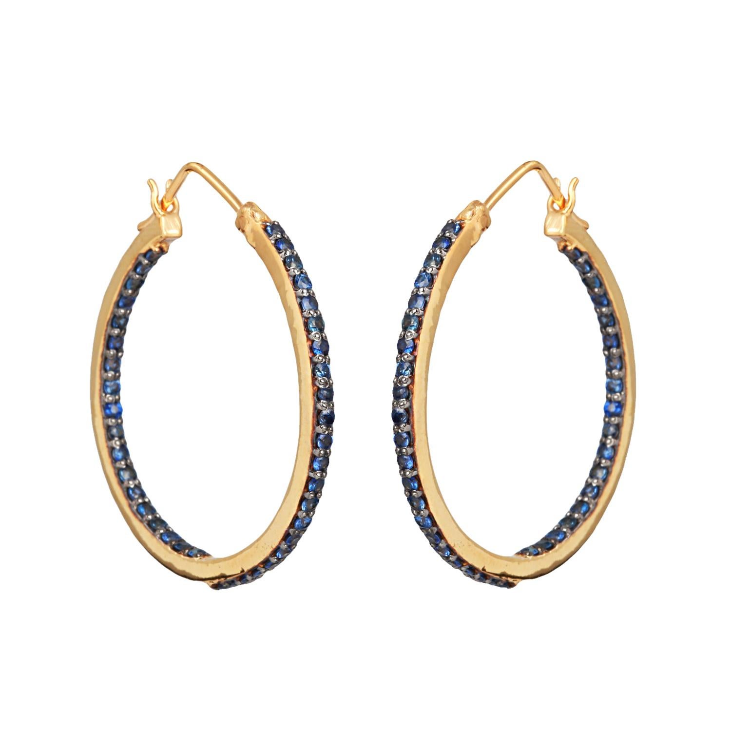 Gemstone Sapphire Hoop gold Earrings with 1.98 carat sapphire . Total Gross weight 6.600 grams, 14K polished gold 0.550 grams and 925 sterling silver 5.654 grams.

The Blue Sapphire (Neelam) gemstone helps in handling nerve related tensions,