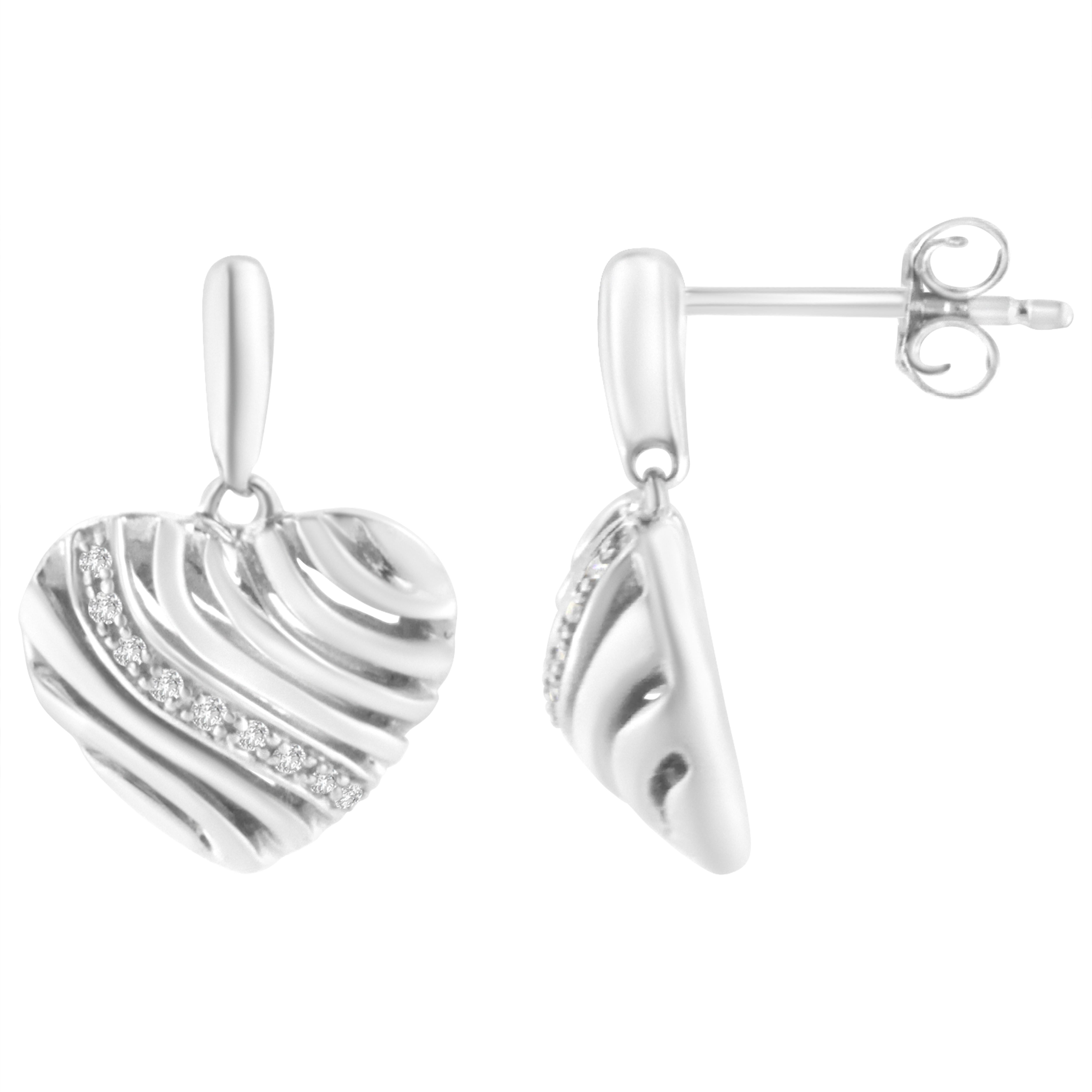 Steal her heart with these chic diamond puff earrings. Fashioned in glowing sterling silver these heart shape puff designed earrings features an array of sparkling 18 pave set single cut diamonds nestled among the gently curves of sterling silver.