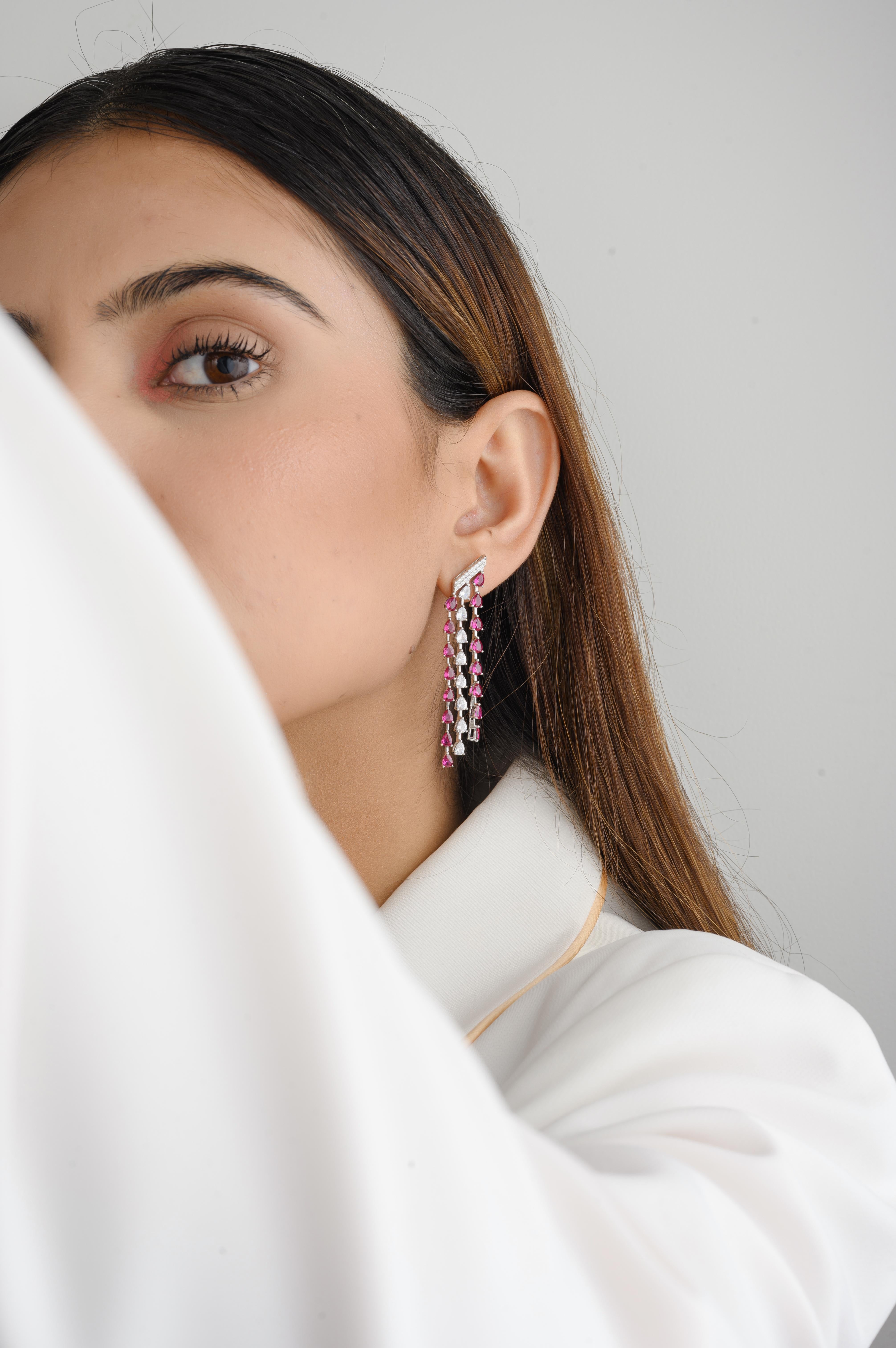 Long Pink and White Zircon Drop Earrings in sterling silver. You shall need long dangle drop earrings to make a statement with your look. Each piece features dazzling cubic zirconia stones, renowned for their brilliance and clarity, set in