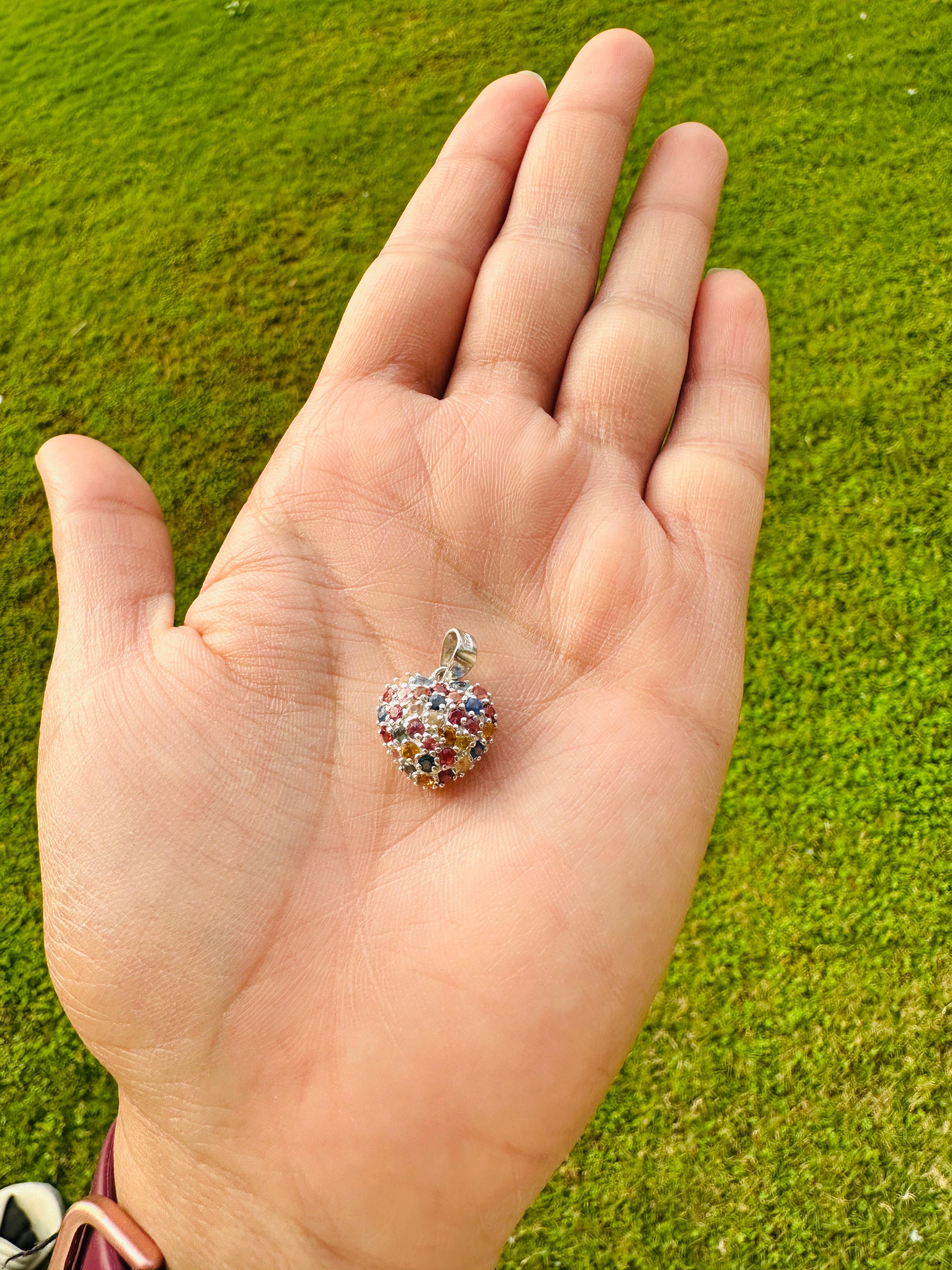 Multi Sapphire Heart Pendant in sterling silver studded with round cut multi sapphire. This stunning piece of jewelry instantly elevates a casual look or dressy outfit. 
Multi Sapphire enhances the intellectual capacity of the person.
Designed with