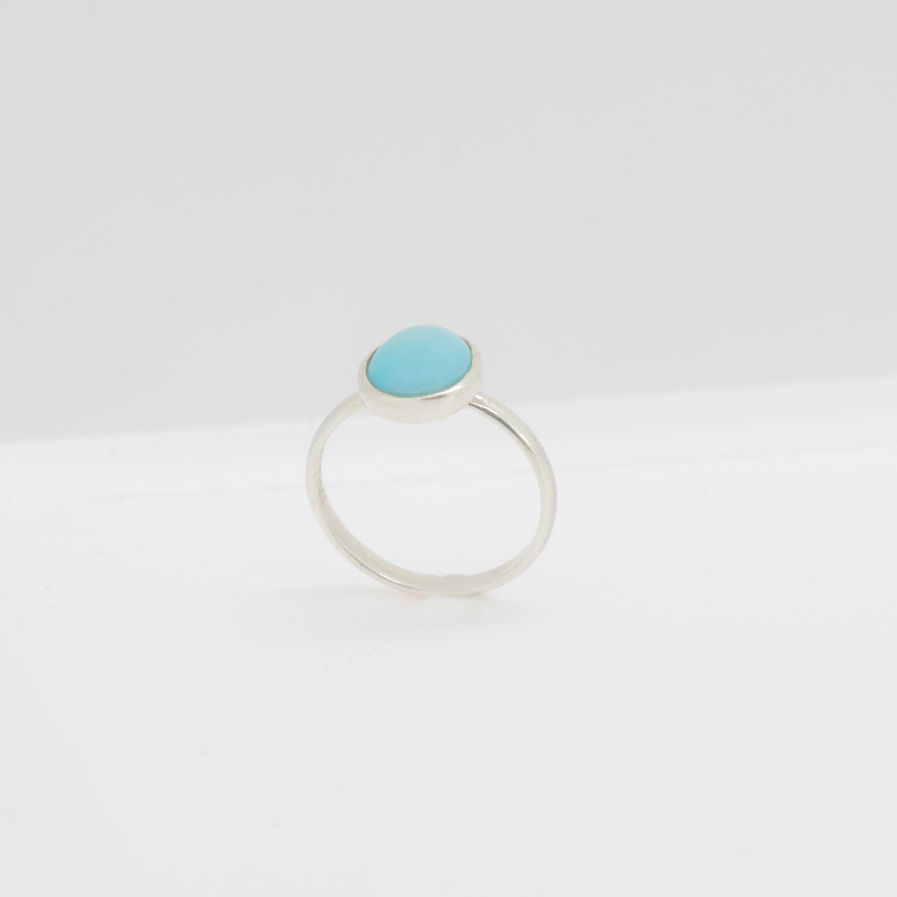 Magnificent natural turquoise oval ring with an exceptional art work, outstanding display of color and Italian craftsmanship designed by Intini Jewels. This unique ring has a natural oval turquoise over a 18 karat yellow gold cocktail design.
 
This