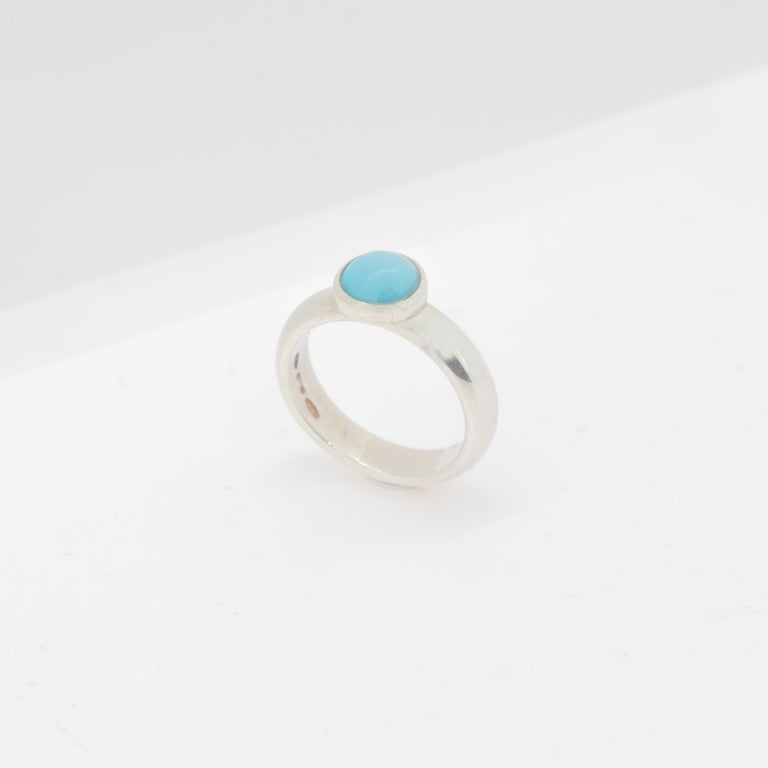 Magnificent turquoise ring with an exceptional art work, outstanding display of color and Italian craftsmanship designed by Intini Jewels. This unique ring has a natural round turquoise over 925 sterling silver cocktail design.
 
This ring