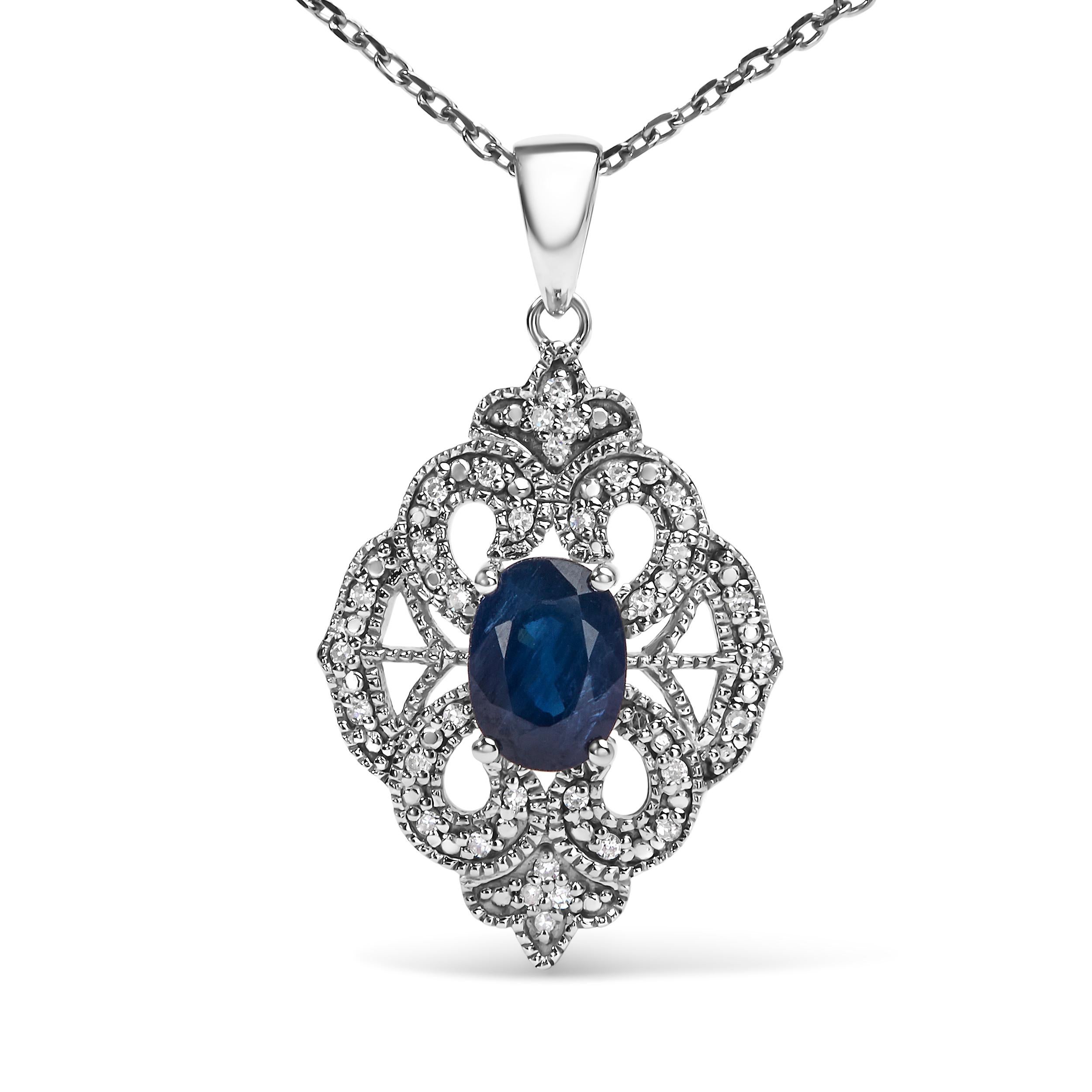 Indulge in the ethereal beauty of this Art Deco style shield-shaped pendant necklace. Crafted with .925 sterling silver, it radiates elegance and grace. Adorned with a captivating 7x5 MM oval blue sapphire and 34 dazzling diamond accents, this