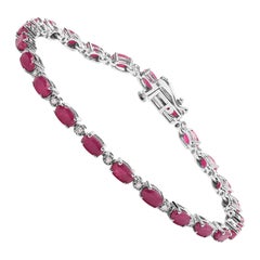 .925 Sterling Silver Oval Ruby and 1/4 Carat Diamond Link Bracelet