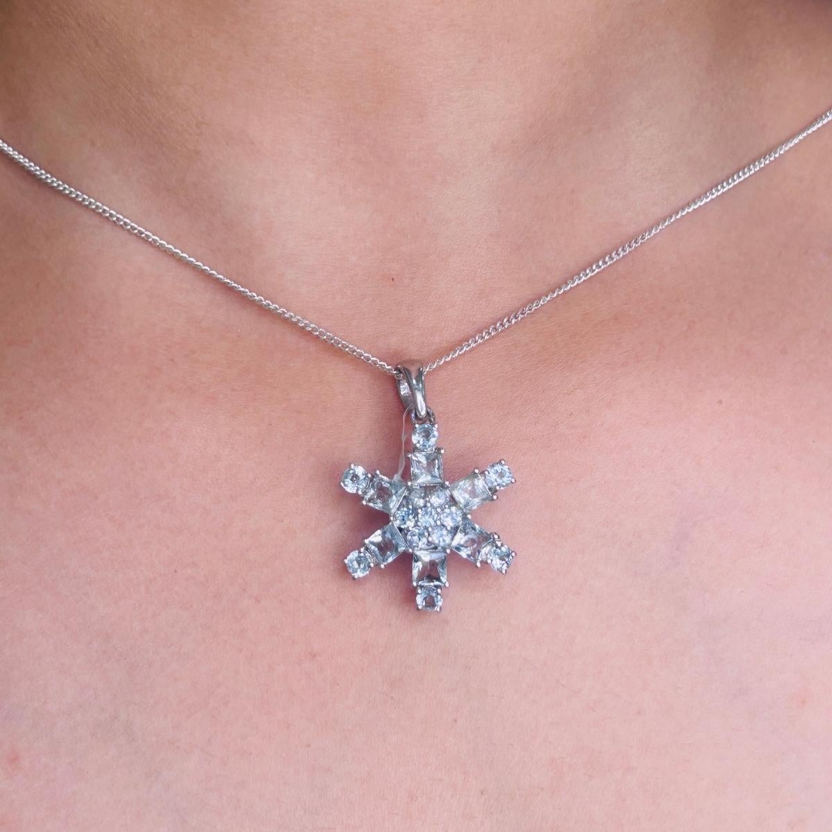 Aquamarine Snowflake Pendant for Grandma In 925 Sterling Silver studded with round, square cut aquamarine. This stunning piece of jewelry instantly elevates a casual look or dressy outfit.
Aquamarine Gemstone enhances the intellectual capacity of
