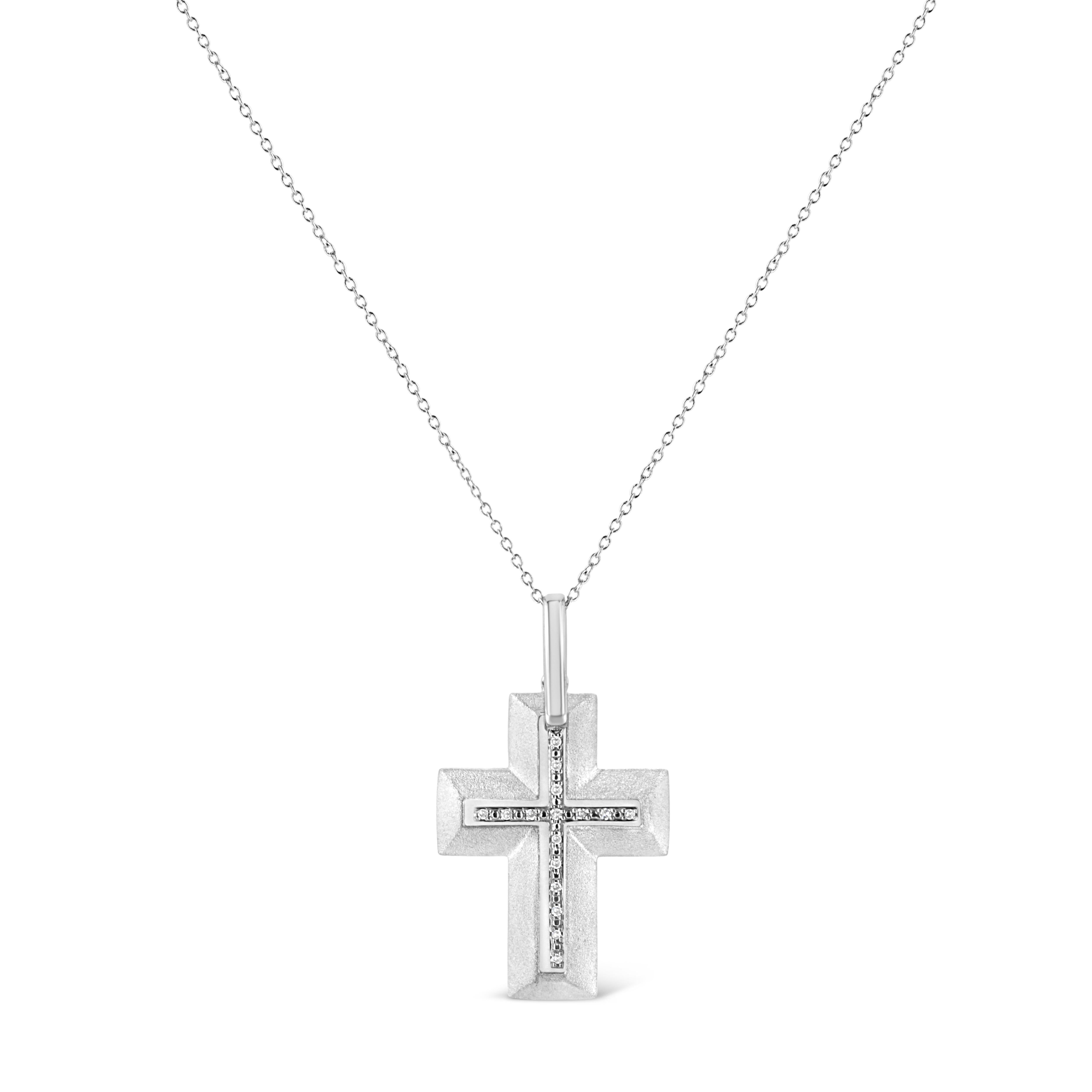 This lovely diamond cross pendant combines spirituality with femininity. Gleaming sterling silver pendant is adorned with 16 prong set radiant single cut diamonds arranged around the cross. It dangles from a elegant cable chain. Total diamond weight
