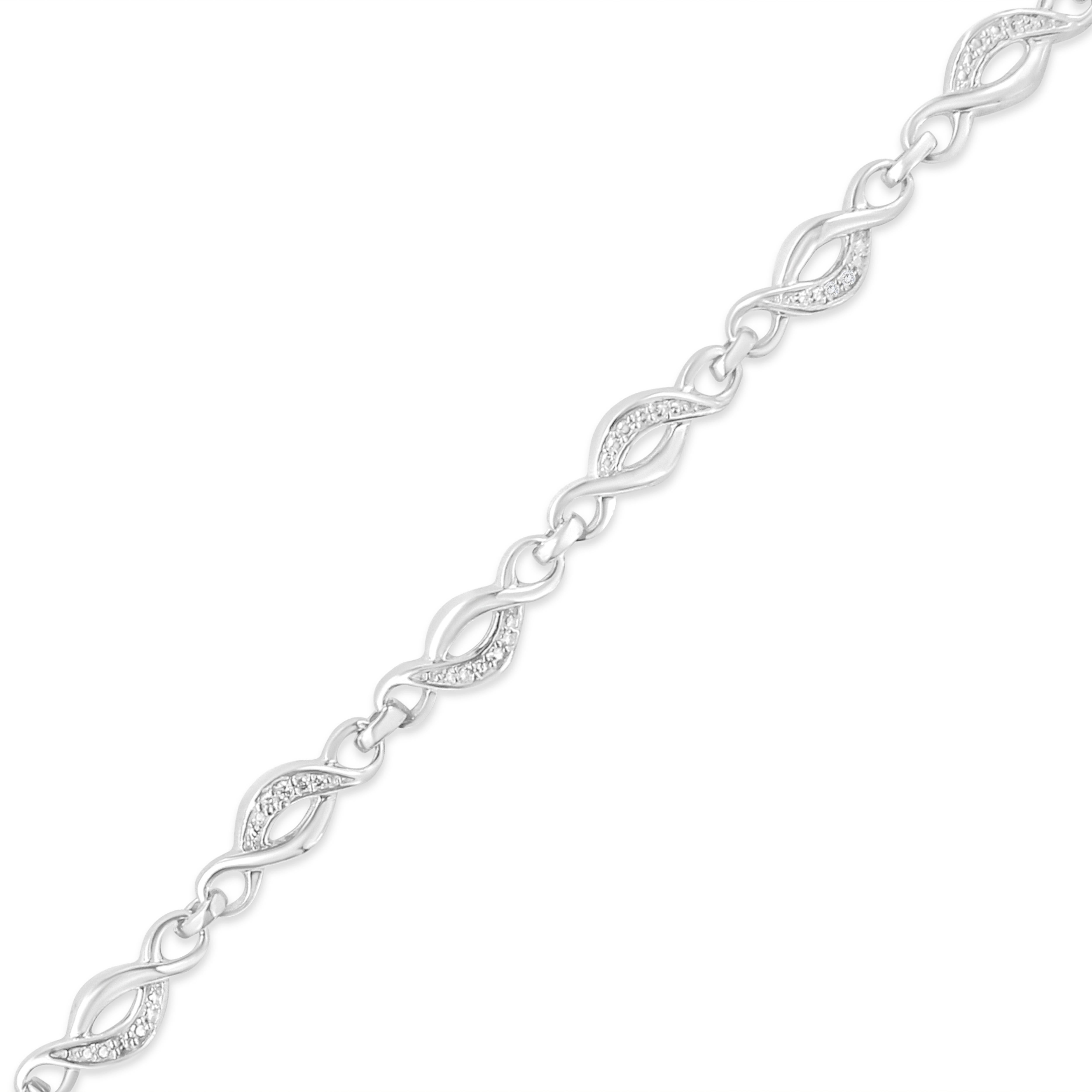 Treat yourself to this elegant and refined infinity link bracelet. Created in cool .925 sterling silver, this piece is designed with silver infinity links, alternating set with round-cut diamonds. This prong set, diamond accent piece is 7.25 inches