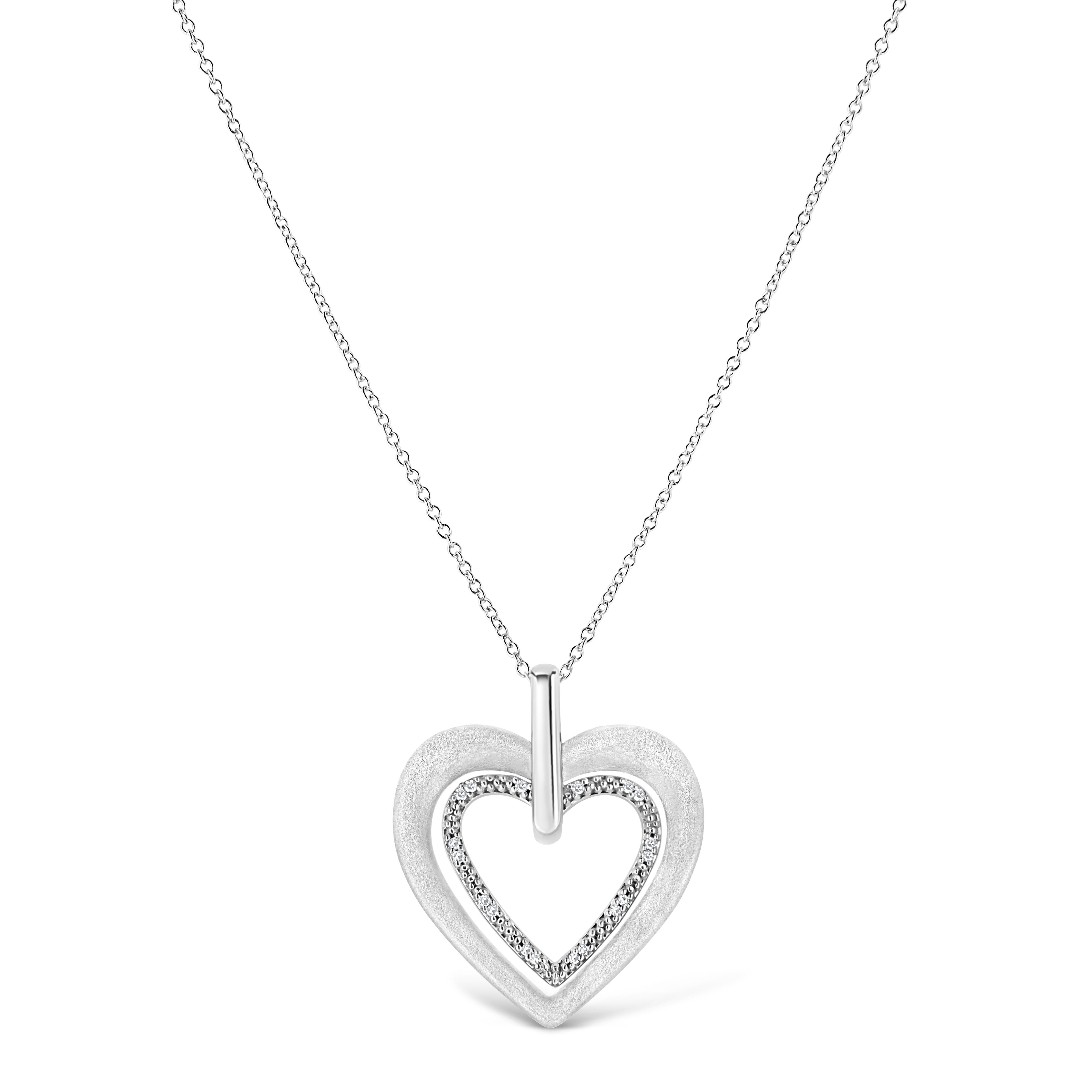 Let this heart shape diamond pendant symbolizes your unconditional love for her. Fashioned in luminous sterling silver this pendant showcasing 18 sparkling prong set single cut diamonds, set on heart motif and dangles from a shimmering cable chain.