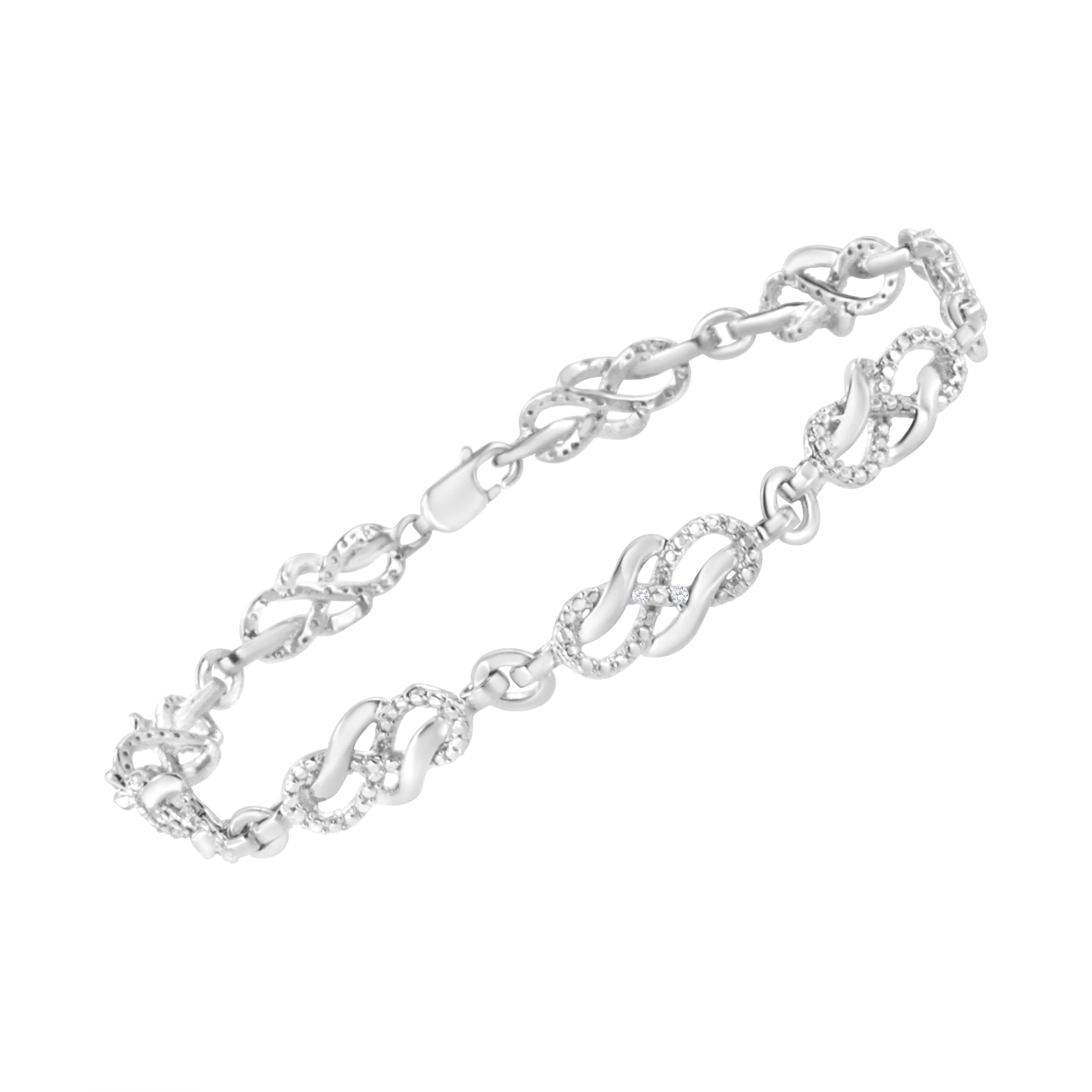 Treat yourself to this elegant and refined infinity link bracelet. Created in cool .925 sterling silver, this piece is designed with silver infinity links, alternating set with round-cut diamonds. This prong set, diamond accent piece is 7.25 inches