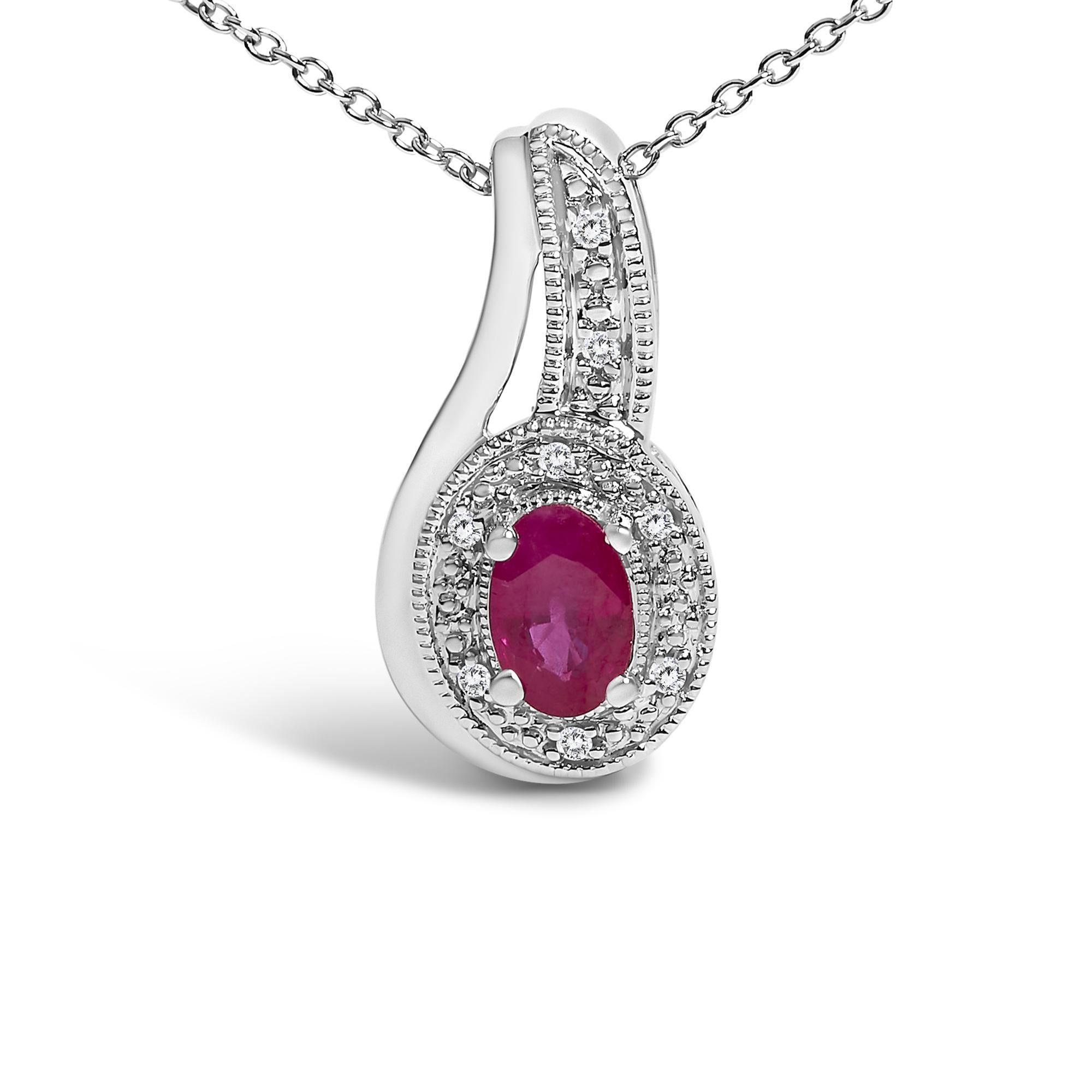 Embrace timeless elegance with this exquisite pendant necklace, where the allure of a natural, heat-treated red ruby meets the subtle shimmer of diamonds. Centered around a captivating 4x6 mm oval-shaped ruby, each glance reveals a crimson depth