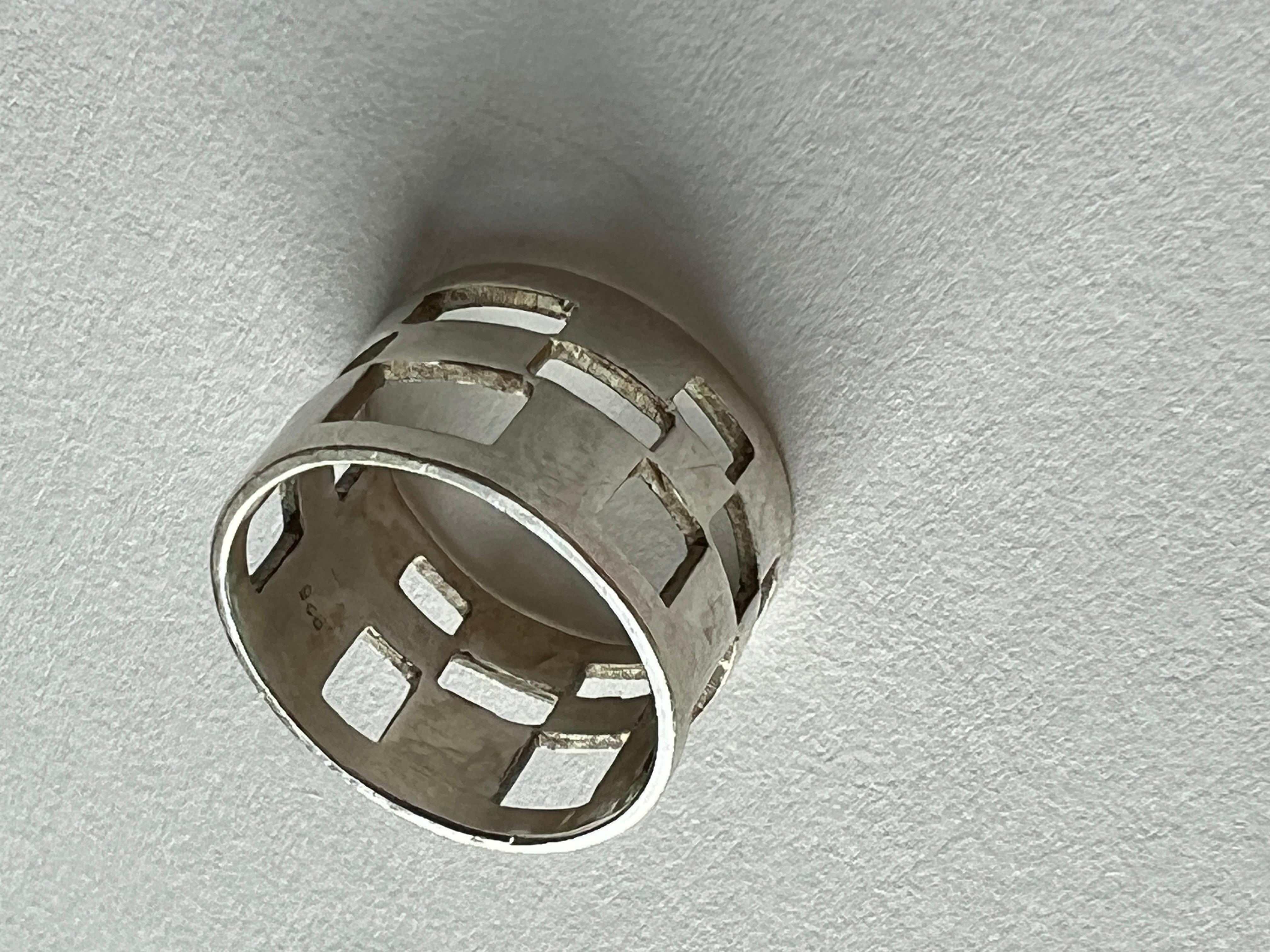 Unique ring with a square holes and a retro vibe. 
Solid feel, sophisticated and unique. 

Weight: 0.16 oz (4.4 grams)
Size: 5.5 
Condition: new 
Stamp: 925  

Jewelry for the forever young