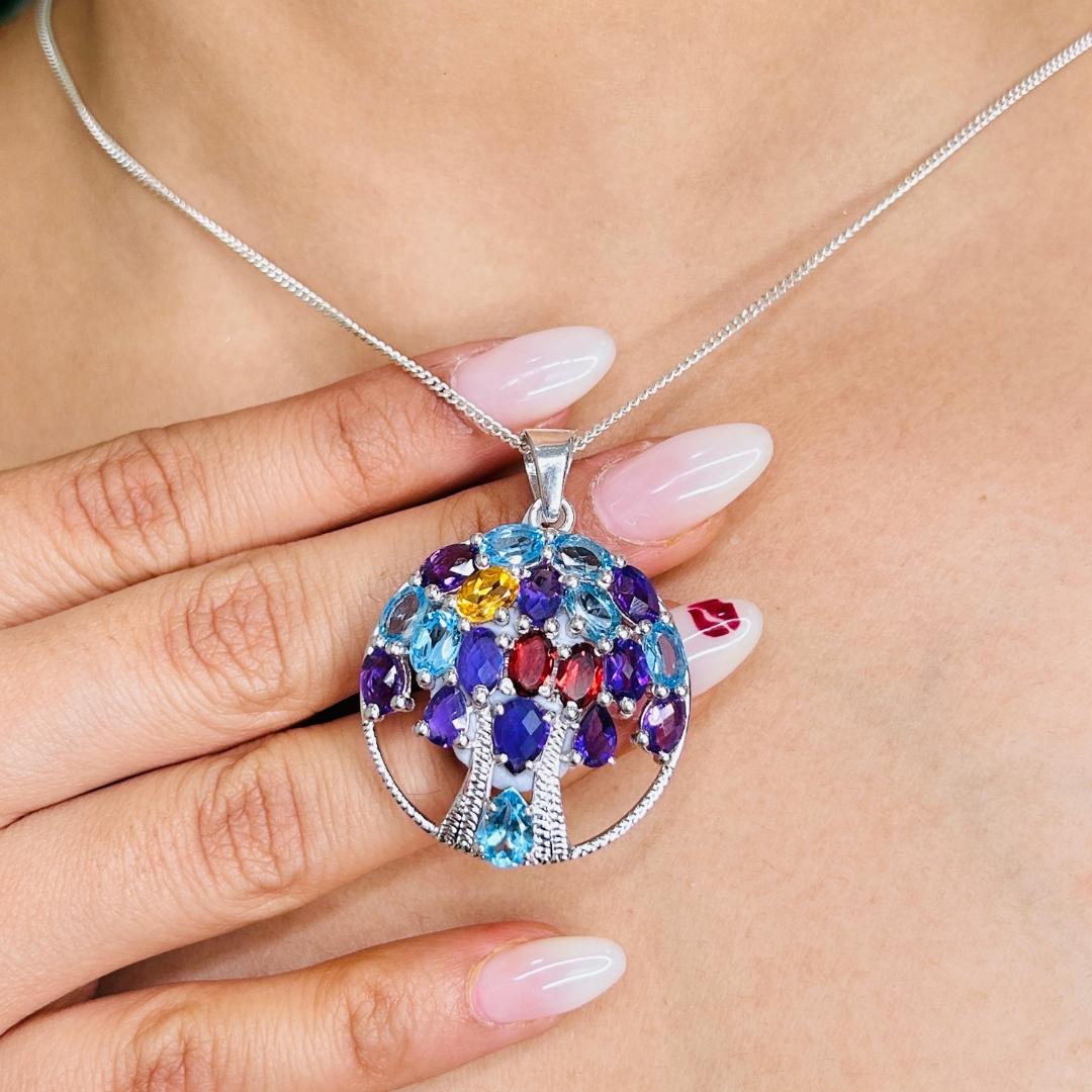 Tree of Life Multi Gemstone Circle 925 Sterling Silver Pendant in sterling silver studded with round cut multi gemstone. This stunning piece of jewelry instantly elevates a casual look or dressy outfit. 
Multi Gemstone enhances the intellectual