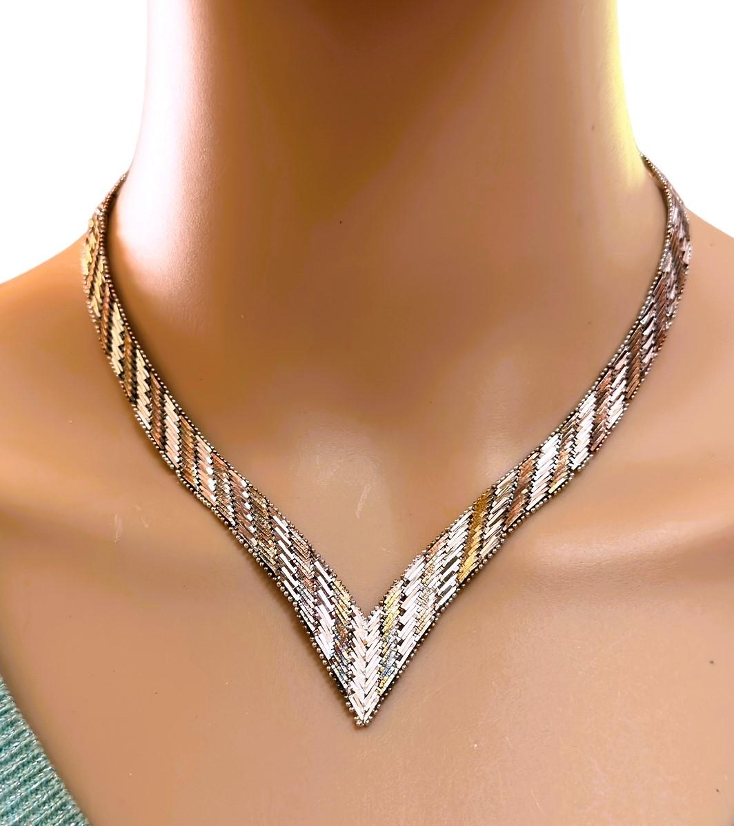 Vintage Italy 925 Sterling Silver Chevron Herringbone Two-Color V Shape Necklace with a Box Clasp Closure.  It's a nice heavy flexible necklace.  The Necklace is 18” long and weighs 38.73 Grams.  It drapes beautifully around the neck and forms a