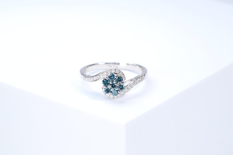 Stunning, timeless and classy eternity Unique Ring. Decorate yourself in luxury with this Gin & Grace Ring. The 925 Sterling Silver jewelry boasts with Natural Round-cut white Diamond (24 Pcs) 0.15 Carat, Blue Diamond (7pcs) 0.31 carat accent stones