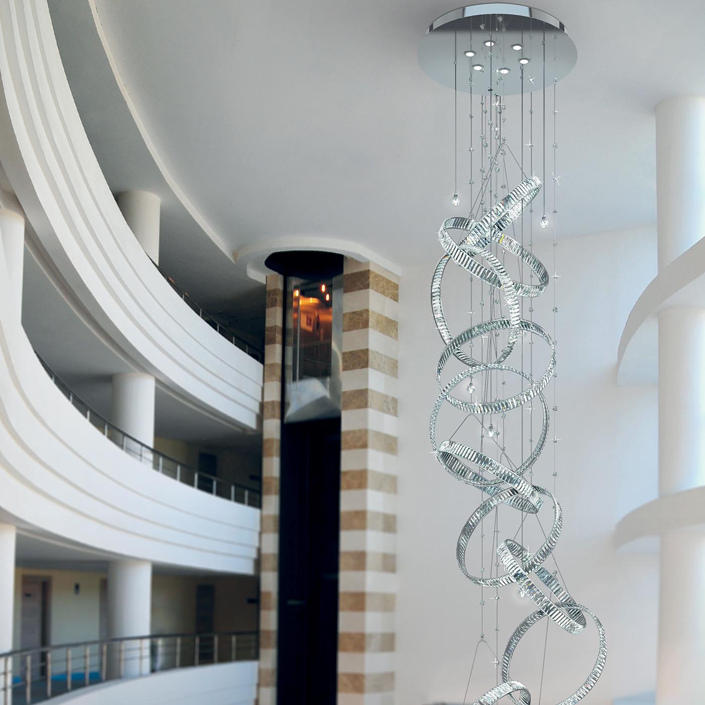 A unique chandelier that will impress anyone who sees it for the first time thanks to its combination of uniqueness and luxury. It is made in transparent crystal and it uses 6 G9 lamps and 6 LED 8 Watt lamps. It is available in the chrome finish.
