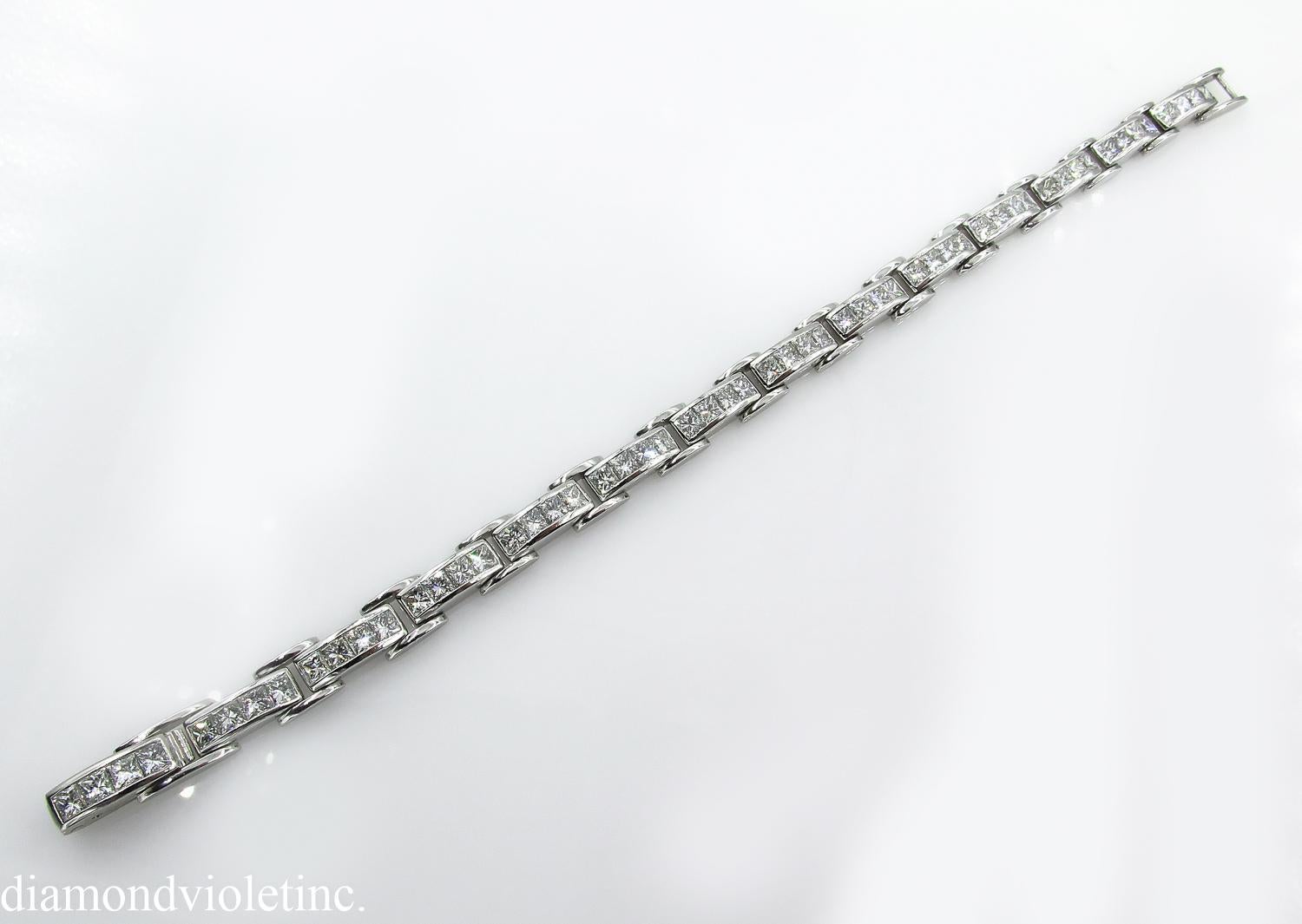 An Amazing Estate Diamond Handmade Platinum (stamped) Tennis Bracelet with over 56 Princess cut Diamonds in F-G color, VS clarity over all; estimated total weight of the diamonds is 9.25ctw, Gemologic appraised.
The length of the bracelet is 7