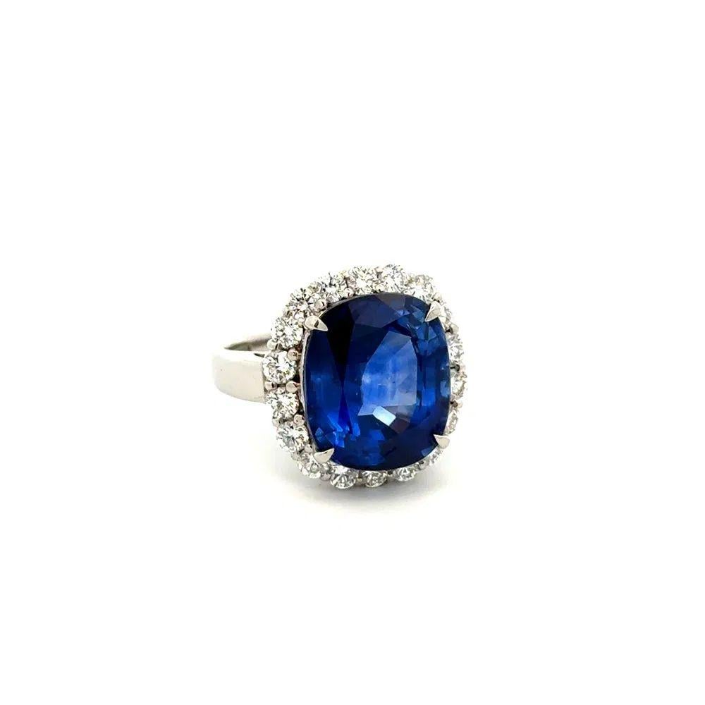 Simply Beautiful! Finely detailed Breathtaking Exquisite Cushion Deep Royal Blue Sapphire and Diamond Platinum Vintage Estate Cocktail Ring. Centering a securely nestled Hand set Cushion Sapphire, weighing approx. 9.26 Carat. The Sapphire's rich,