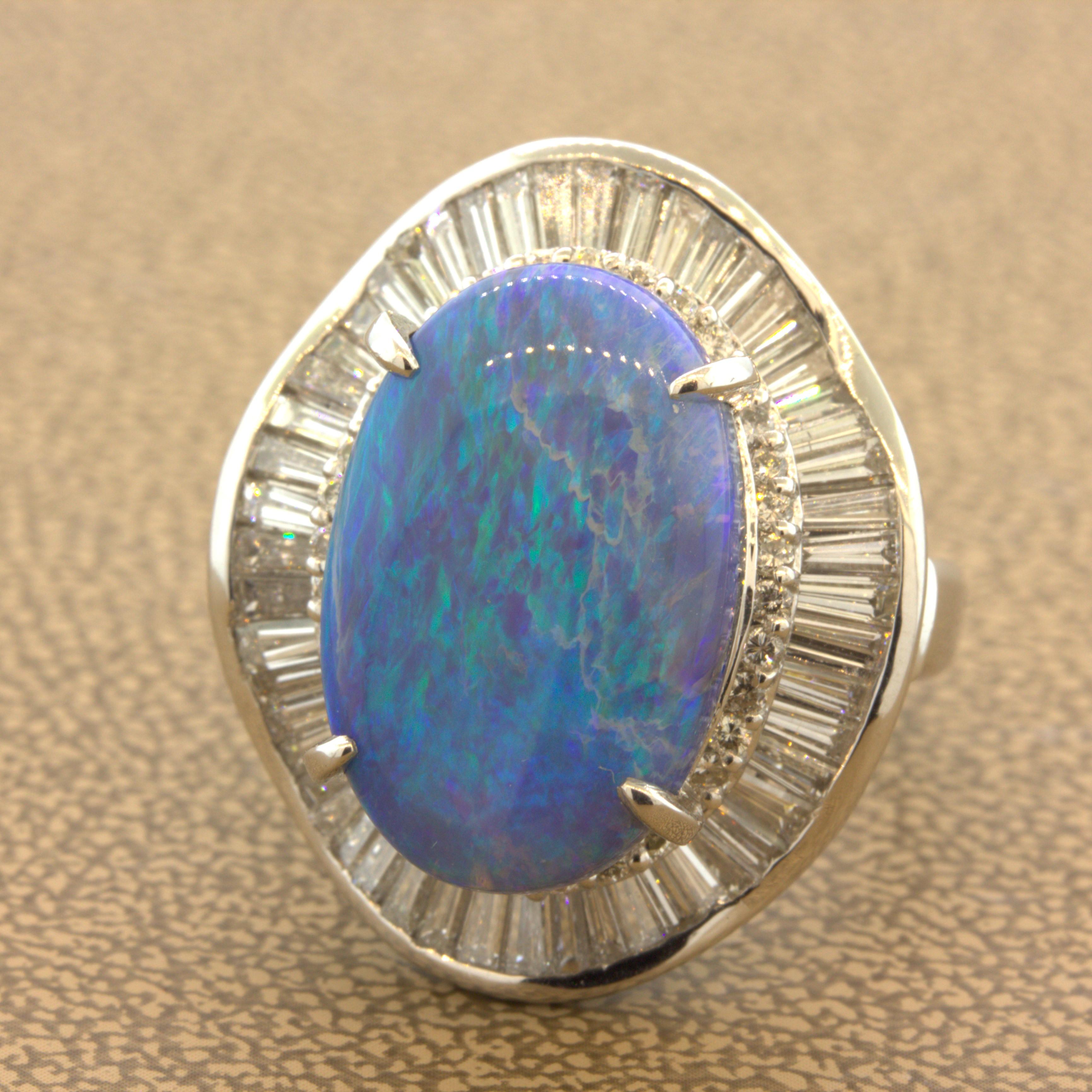 A large and impressive cocktail ring featuring a natural Australian black opal weighing 9.27 carats. It has excellent color as various shades of blue and green radiate across the stone. It is surrounded by a spiraling halo of round brilliant and