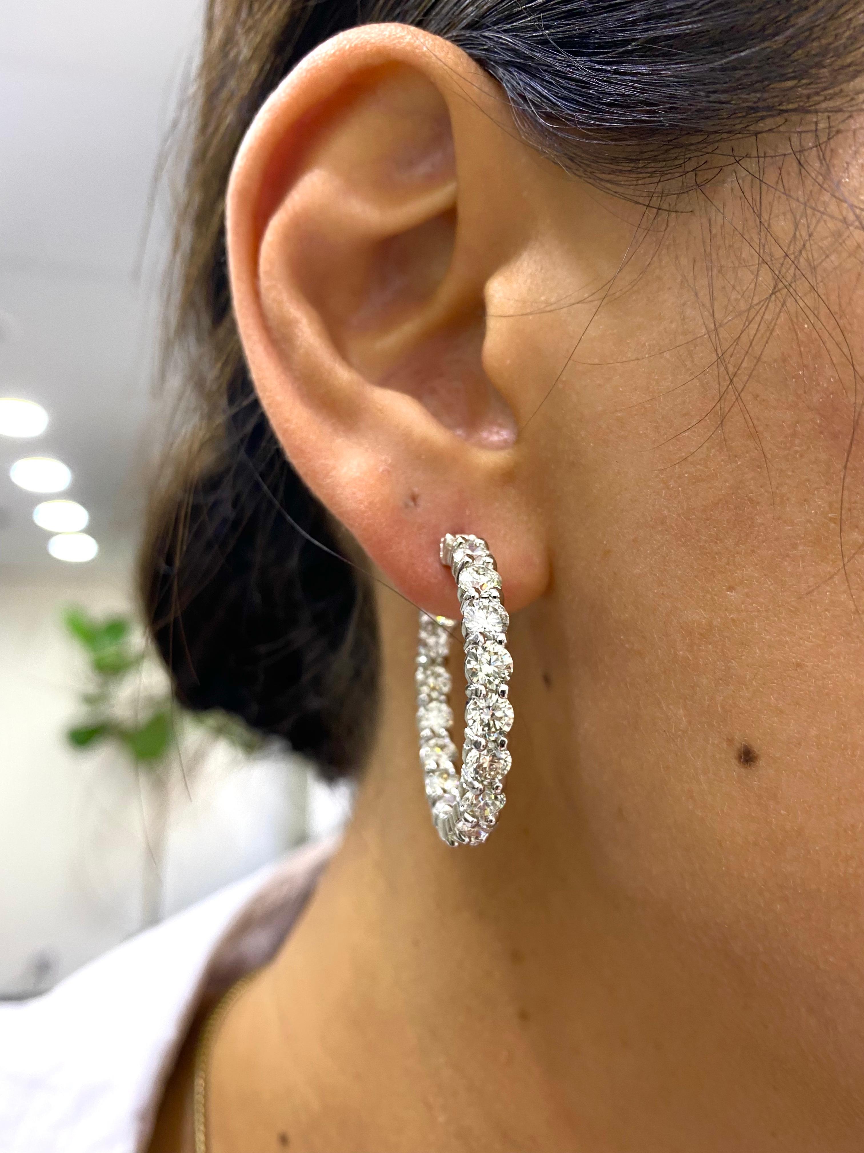 9.27 Carat Large Diamond Hoop Earrings in White Gold 

These hoops sparkle with brilliance, and its quality in materials and craftsmanship can be felt immediately.  Featuring 9.27 carats of round brilliant diamonds in H color, and VS2-VS1 clarity.