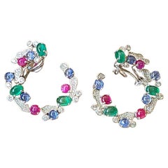 9.28 Carats, Blue Sapphire, Emerald
Ruby Tutti Frutti Style Hoop Earrings 9.28 Carats, Blue Sapphire, Emerald
Ruby Tutti Frutti Style Hoop Earrings