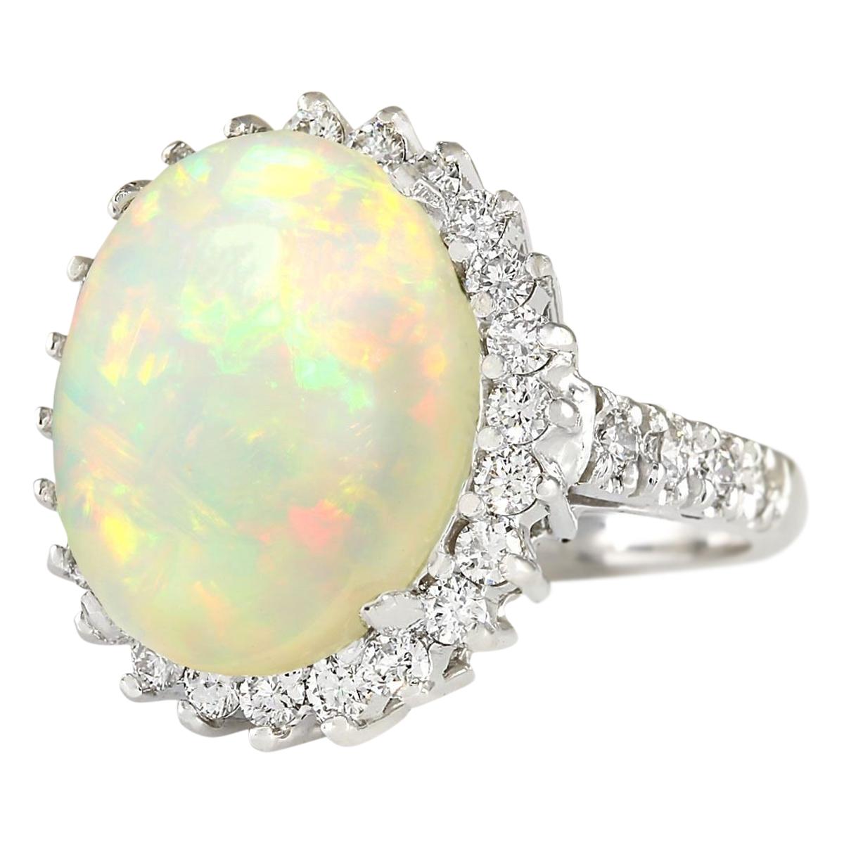 Introducing our exquisite 9.29 Carat Natural Opal 14 Karat White Gold Diamond Ring, a masterpiece of elegance and sophistication. Crafted from 14K White Gold and stamped for authenticity, this ring boasts a total weight of 8.5 grams, ensuring both