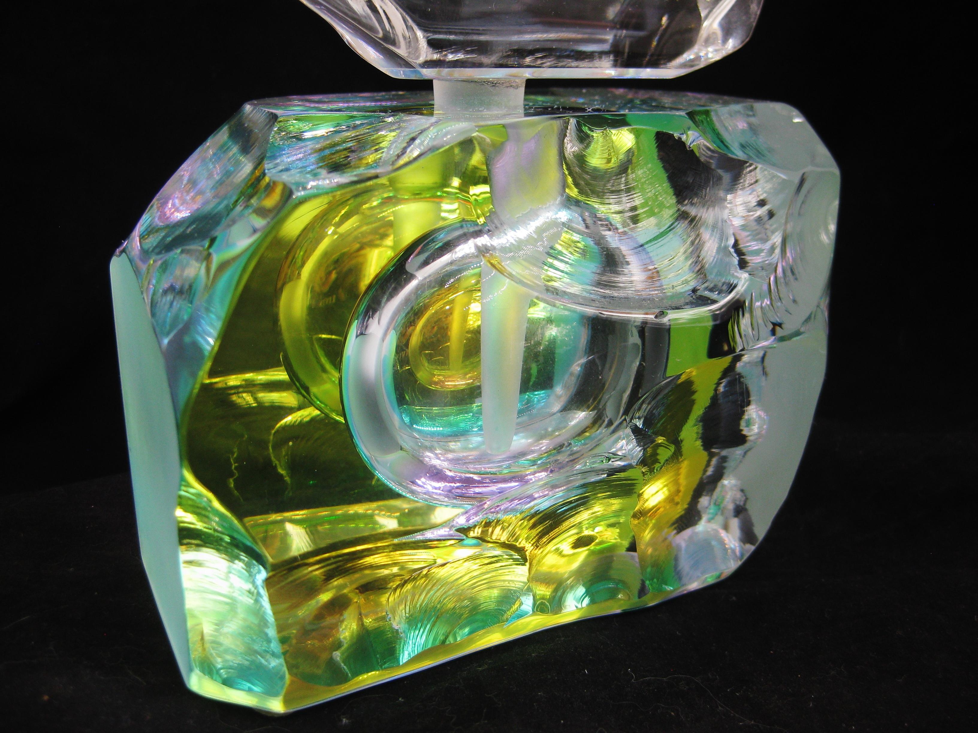 Stunning large studio art glass abstract dichroic perfume bottle by artist Steven M. Maslach. The perfume bottle is signed on the bottom and dates from 1993. The perfume bottle has a wonderful iridescent surface that changes colors in different