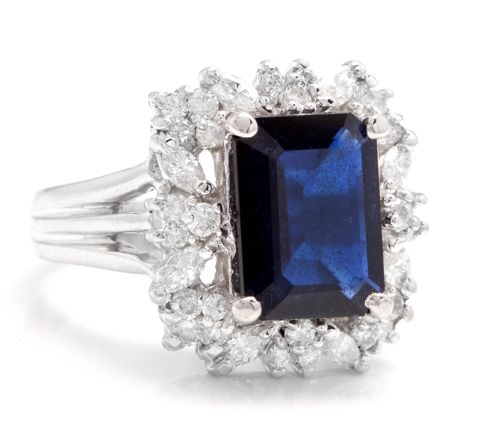 9.30 Carats Exquisite Natural Blue Sapphire and Diamond 14K Solid White Gold Ring

Total Blue Sapphire Weight is: Approx. 8.00 Carats

Sapphire Measures: Approx. 12.00 x 10.00mm

Sapphire Treatment: Diffusion

Natural Round & Marquise Diamonds