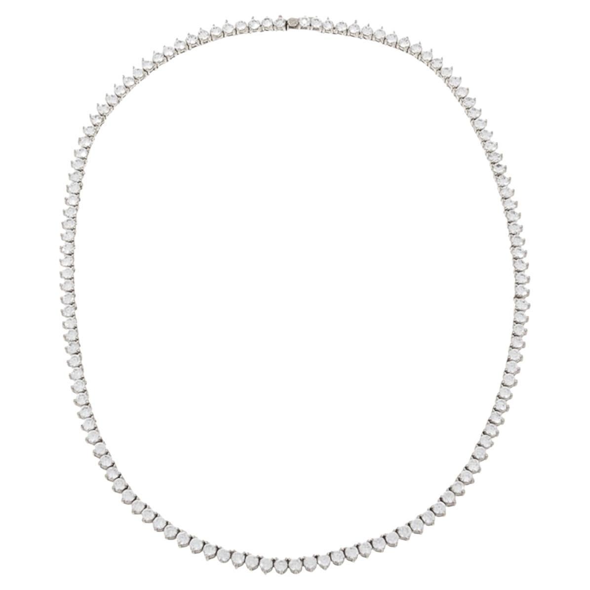 Indulge in the epitome of elegance with our exquisite 10 Carat Round Brilliant Cut Diamonds White Gold Tennis Necklace. This masterpiece, crafted with precision in Italy, showcases the perfect blend of luxury and sophistication.

This necklace will