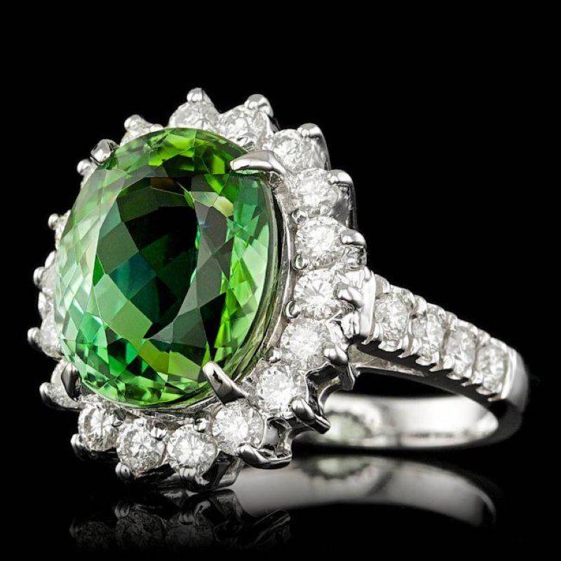 9.30 Carats Natural Green Tourmaline and Diamond 14K Solid White Gold Ring

Total Natural Tourmaline Weight is: Approx. 7.90 Carats 

Tourmaline Measures: Approx. 13.00 x 11.00mm

Natural Round Diamonds Weight: 1.40 Carats (color G-H / Clarity