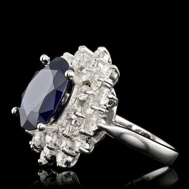 9.30 Carats Natural Sapphire and Diamond 14K Solid White Gold Ring

Total Natural Sapphire Weights: Approx. 6.80 Carats 

Sapphire Measures: Approx. 13.00 x 11.00mm

Sapphire treatment: Diffusion

Natural Round Diamonds Weight: Approx. 2.50 Carats