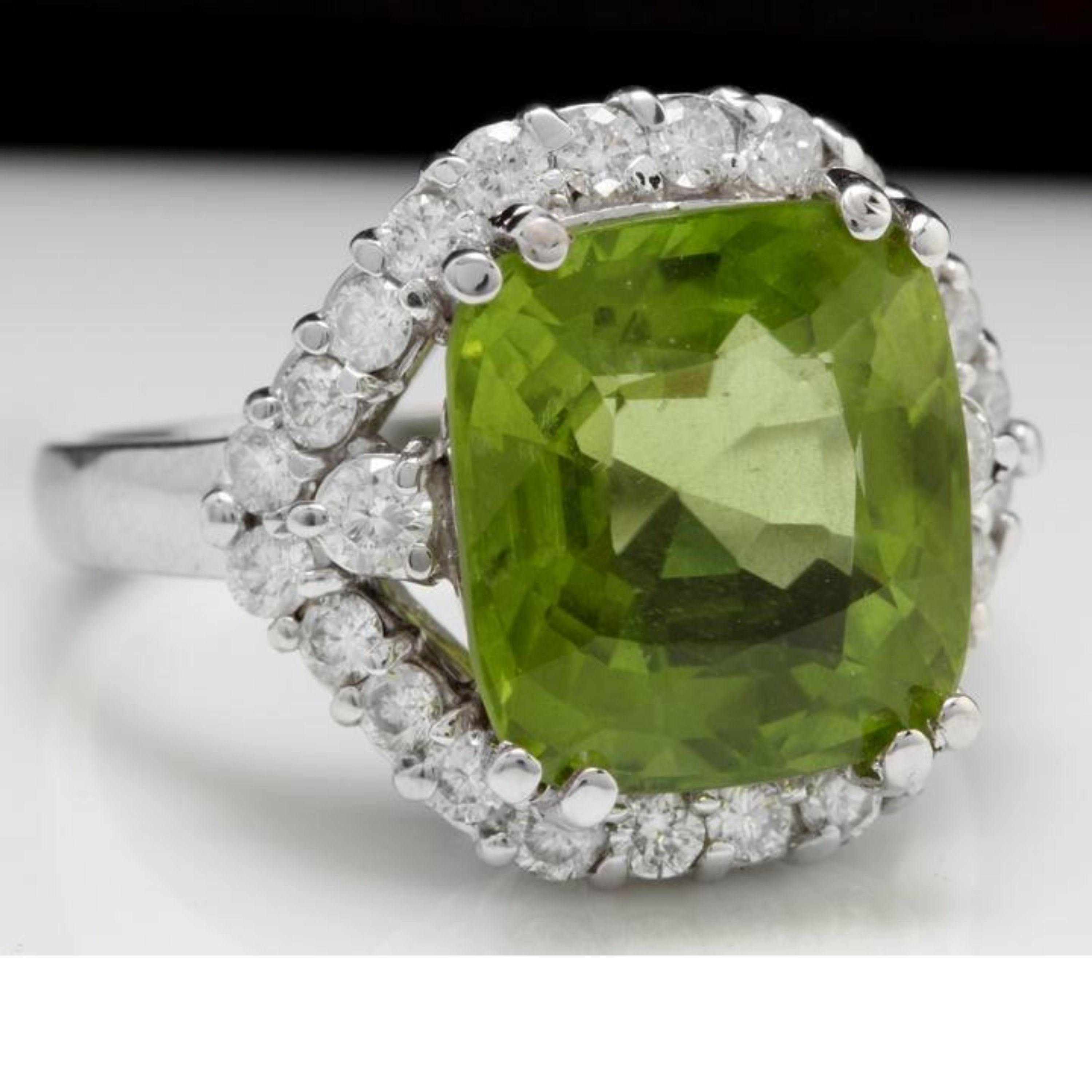 9.30 Carats Natural Very Nice Looking Peridot and Diamond 14K Solid White Gold Ring

Total Natural Cushion Cut Peridot Weight is: Approx. 8.00 Carats

Peridot Measures: Approx. 12 x 11mm

Natural Round Diamonds Weight: Approx. 1.30 Carats (color G-H