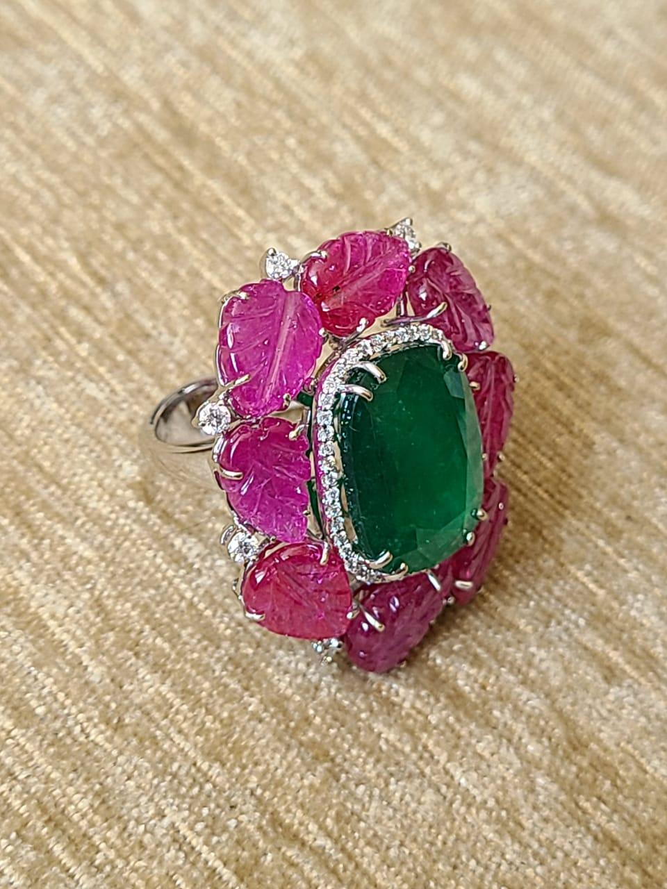 A very Beautiful & Bold Zambian Emerald & Mozambique Ruby Cocktail Ring set in 18K Gold & Diamonds. The Emerald, is completely natural, without any treatment. It is of Zambian origin and weighs 9.31 carats. The Rubies are also completely natural,