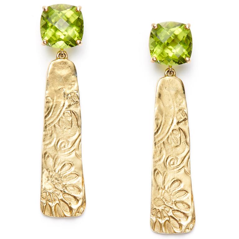 Flash some brilliance with 9 carats of faceted and eye-popping Peridot, attached to stunningly detailed 18 Karat Gold swirly drops. Peridot is said to bring happiness to the wearer. These earrings with definitely do that, no matter where or when you