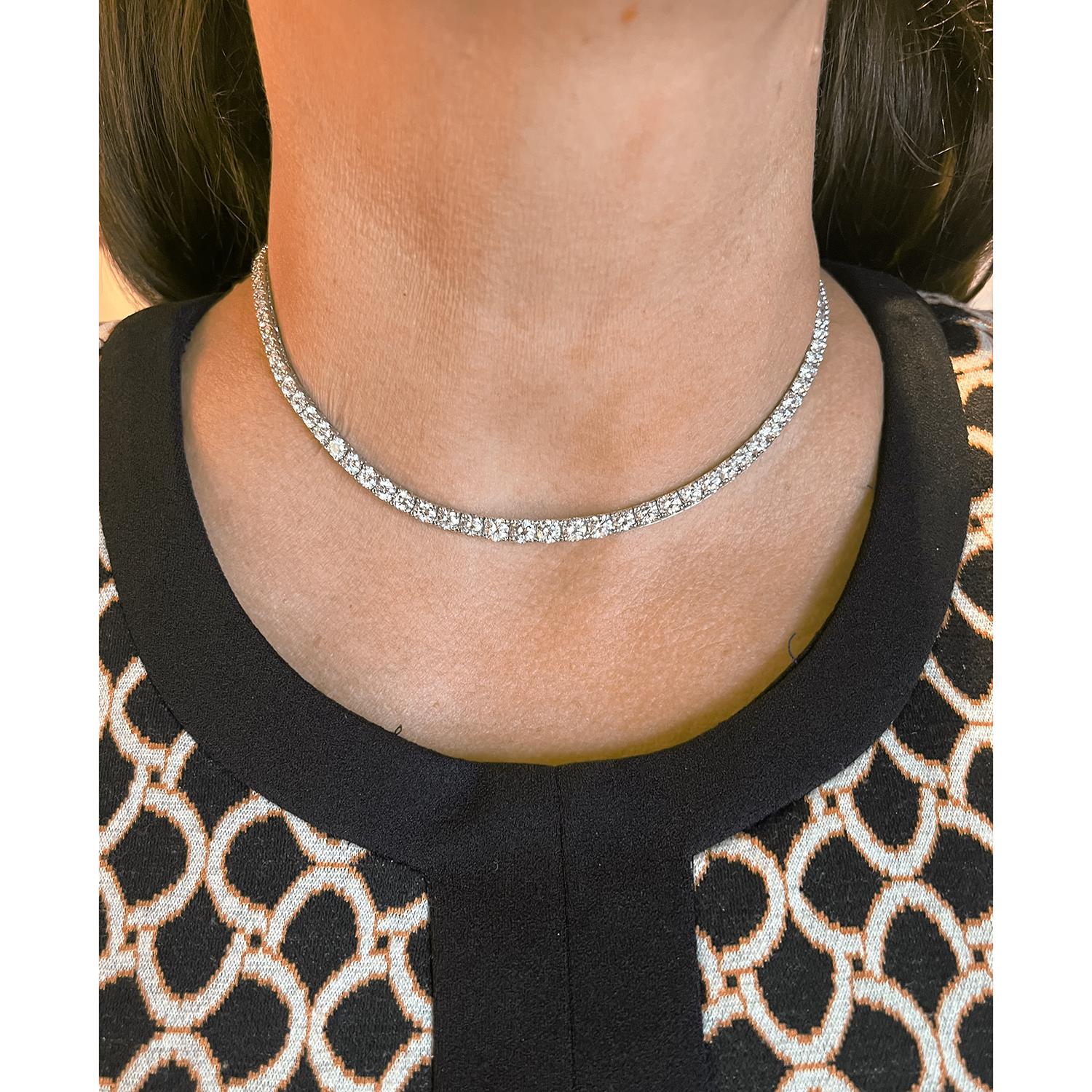 Riviera-style diamond line necklace in 18k white gold, featuring 105 natural fine near-colorless round brilliant-cut natural diamonds weighing approximately 9.33 total carats (G-H color, VS1-VS2 clarity).  Each diamond ranging from 0.12 carats to